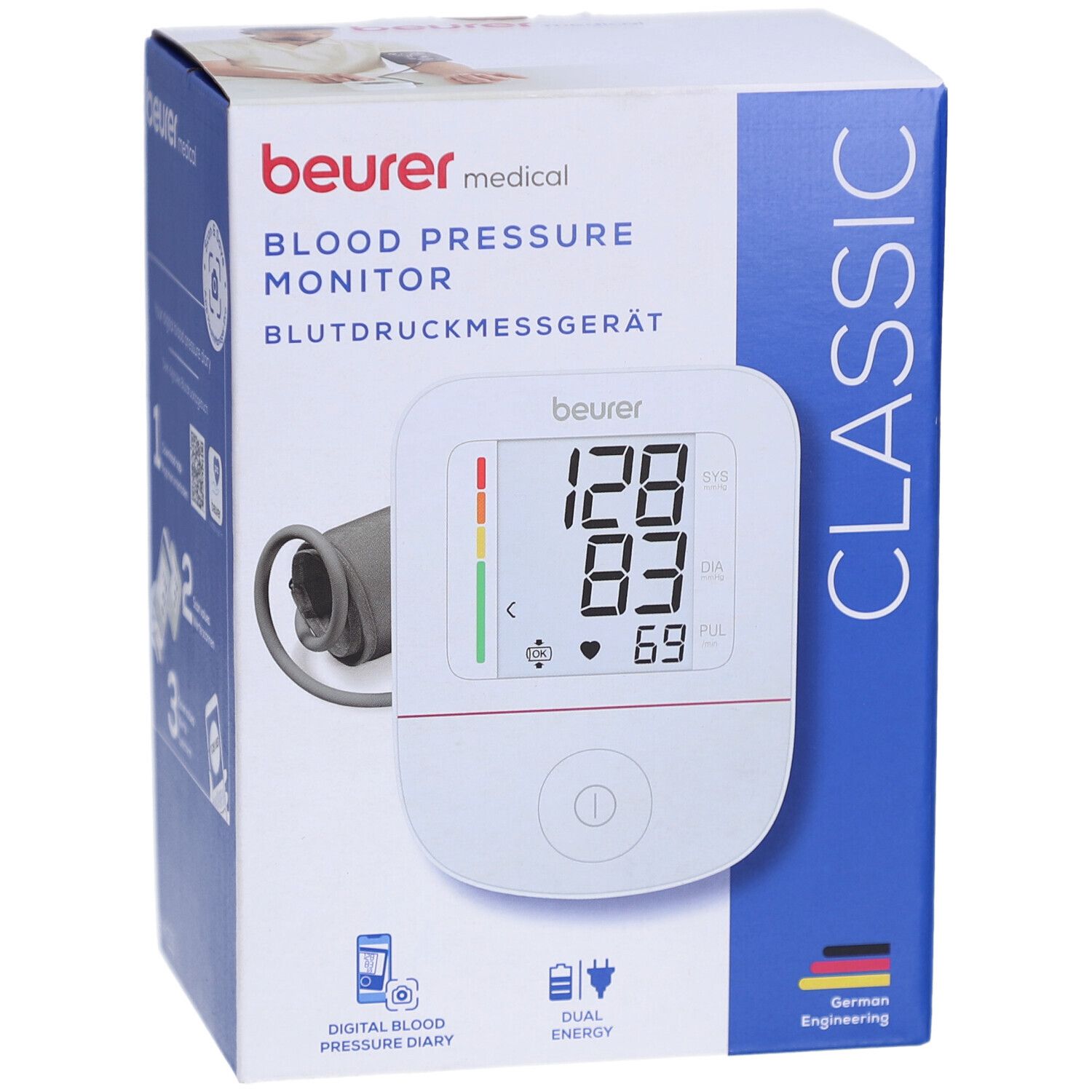 Blutdruckmessgerät in Verpackung. Digitales Display mit Messwerten. Beurer-Logo, ESH-Zertifizierung.