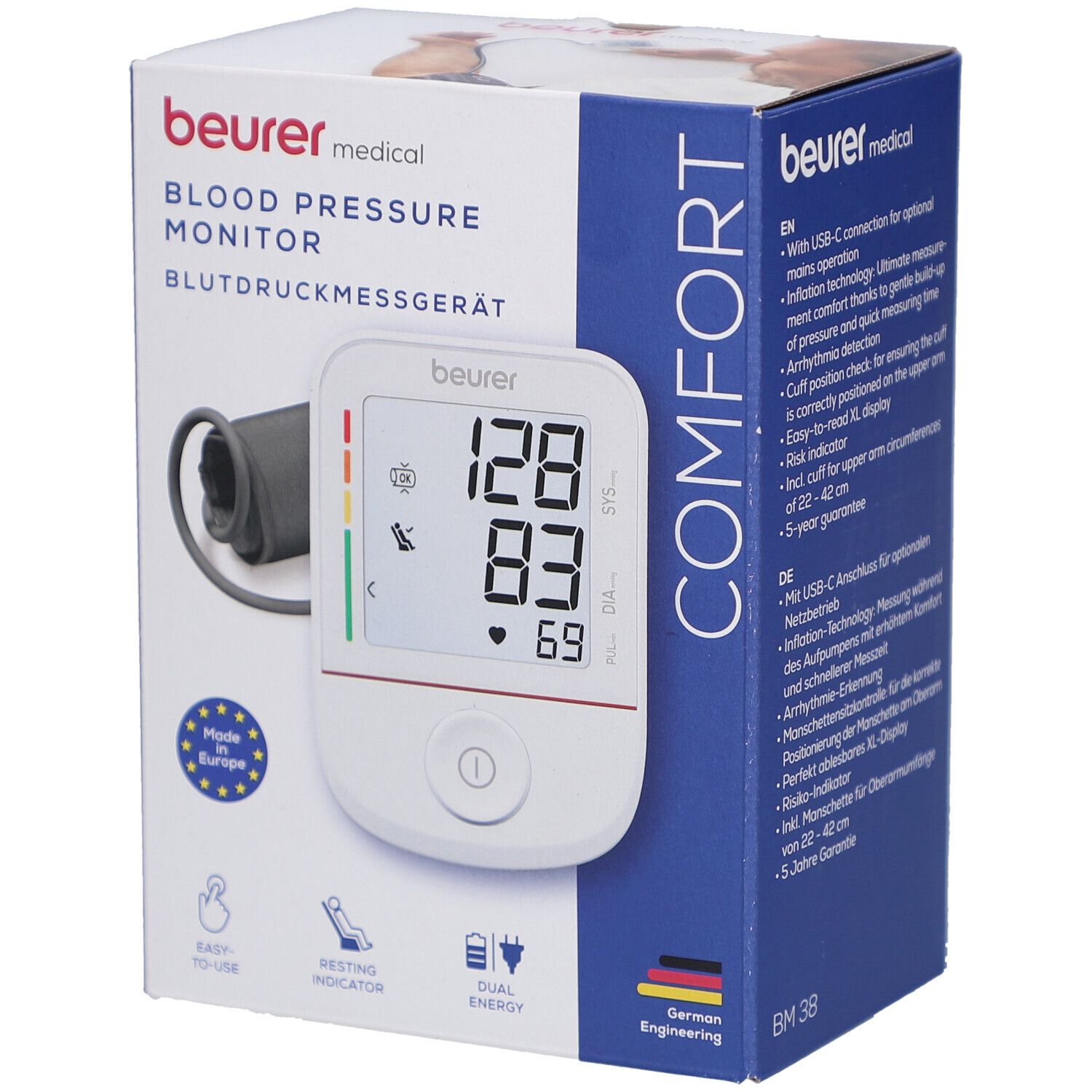Blutdruckmessgerät in Verpackung. Anzeige: 128/83/69. Marke: beurer medical. Mit Manschette und Display. Made in Europe.