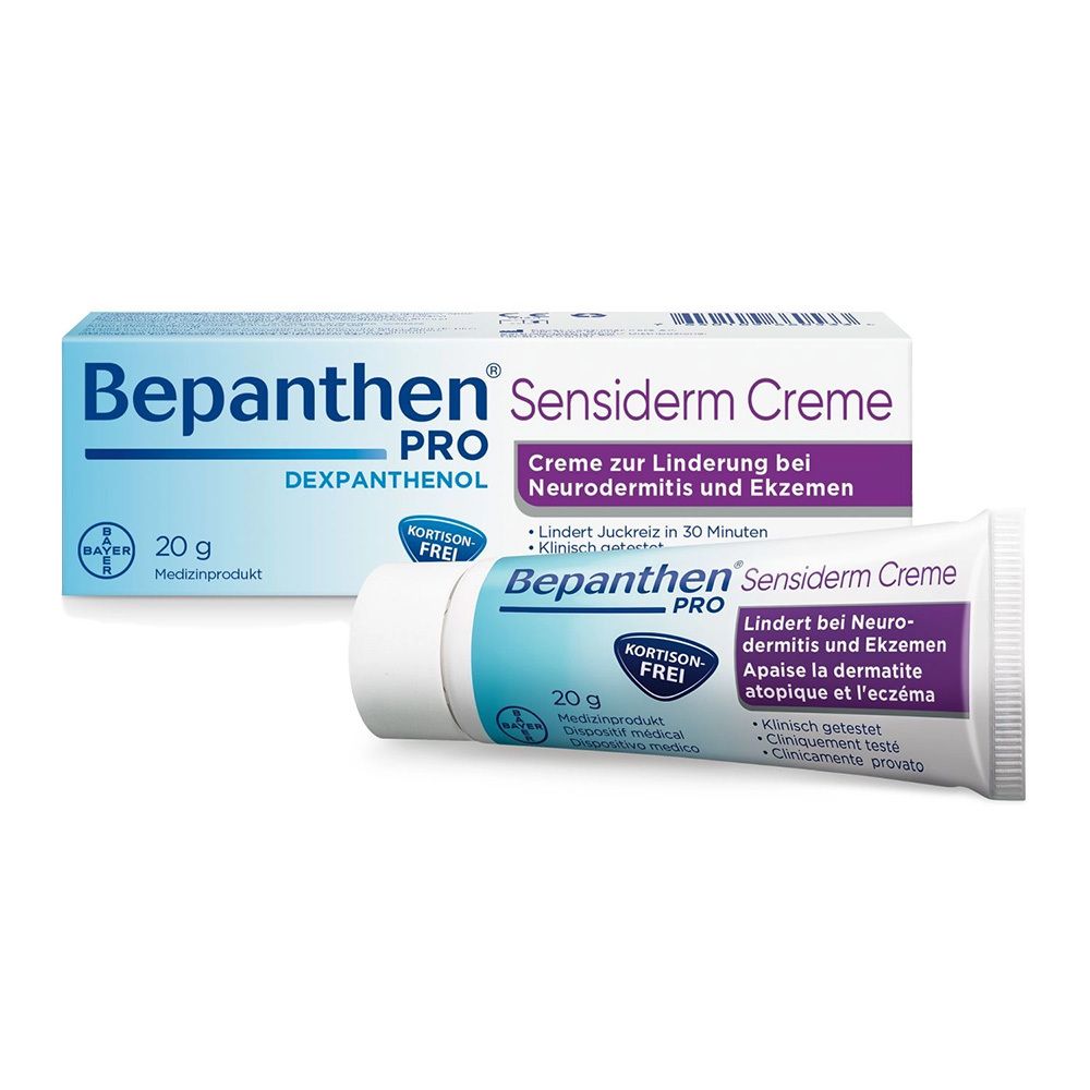 Tube et emballage de crème. Inscription : Bepanthen PRO Sensiderm Crème. 20 g. Sans cortisone.