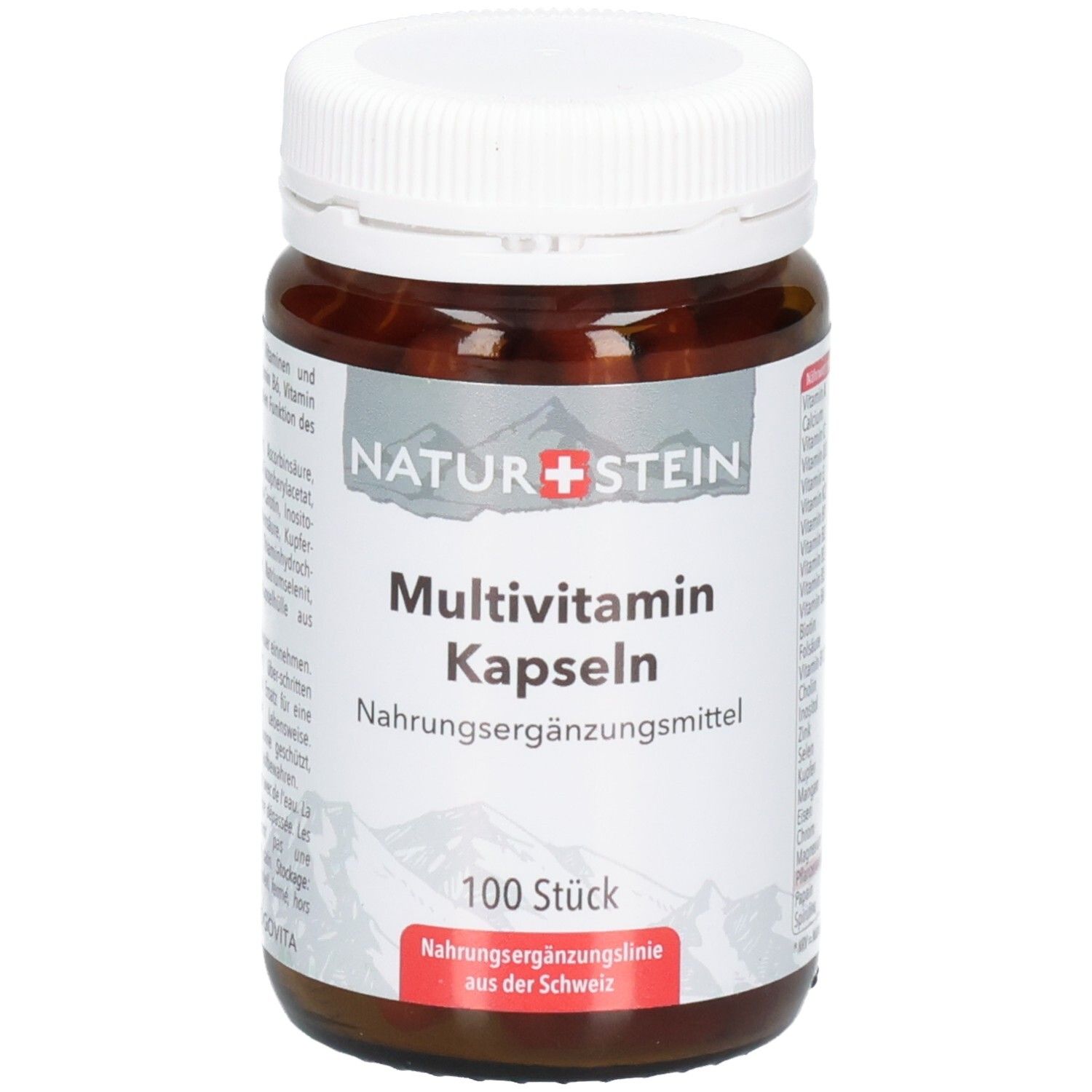 Braune Glasflasche mit weißem Schraubverschluss, gefüllt mit Multivitamin-Kapseln. Etikett mit Bergsilhouette und Produktinformationen.