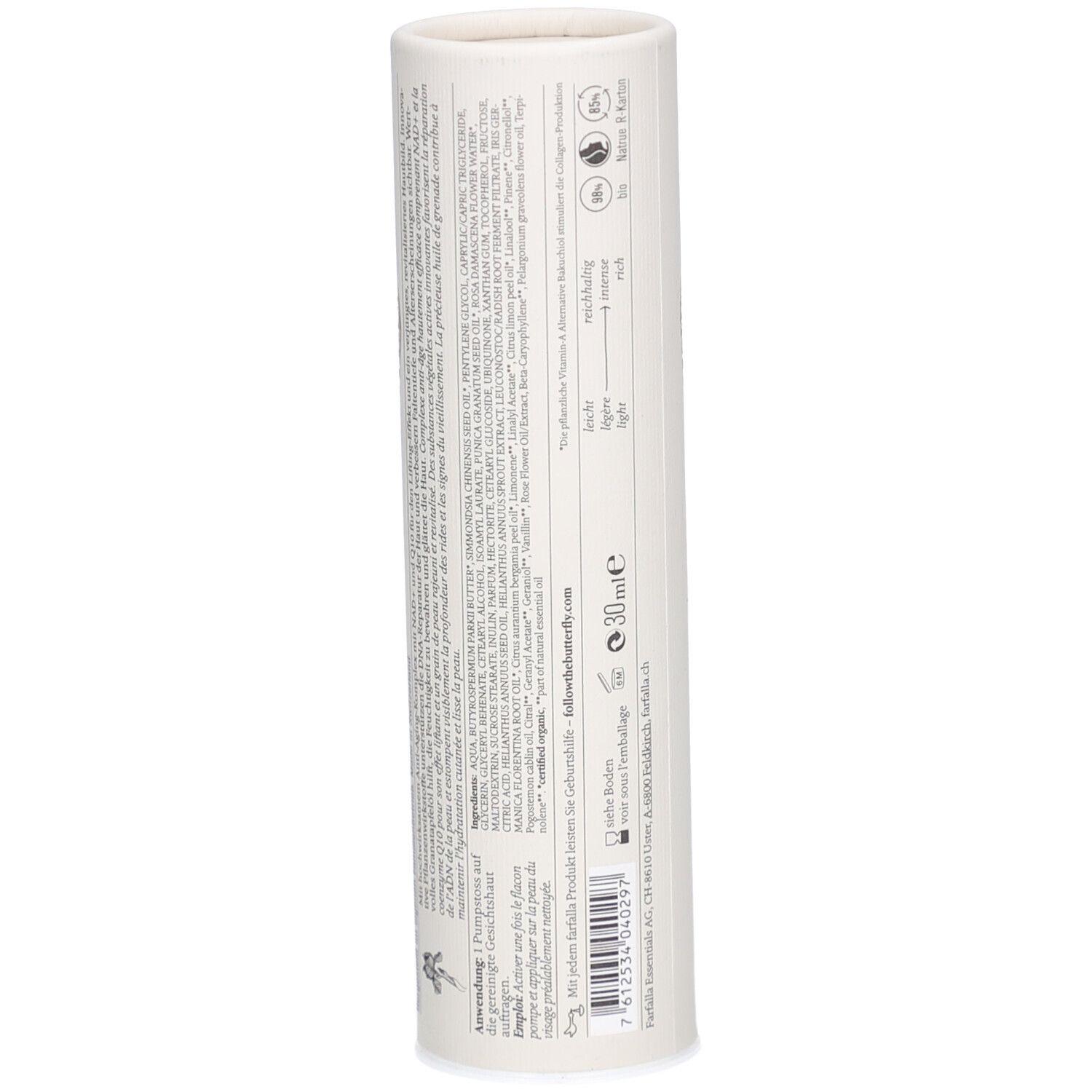 Dos de l'emballage cylindrique. Texte avec ingrédients et informations sur le fabricant. Petit logo en bas.