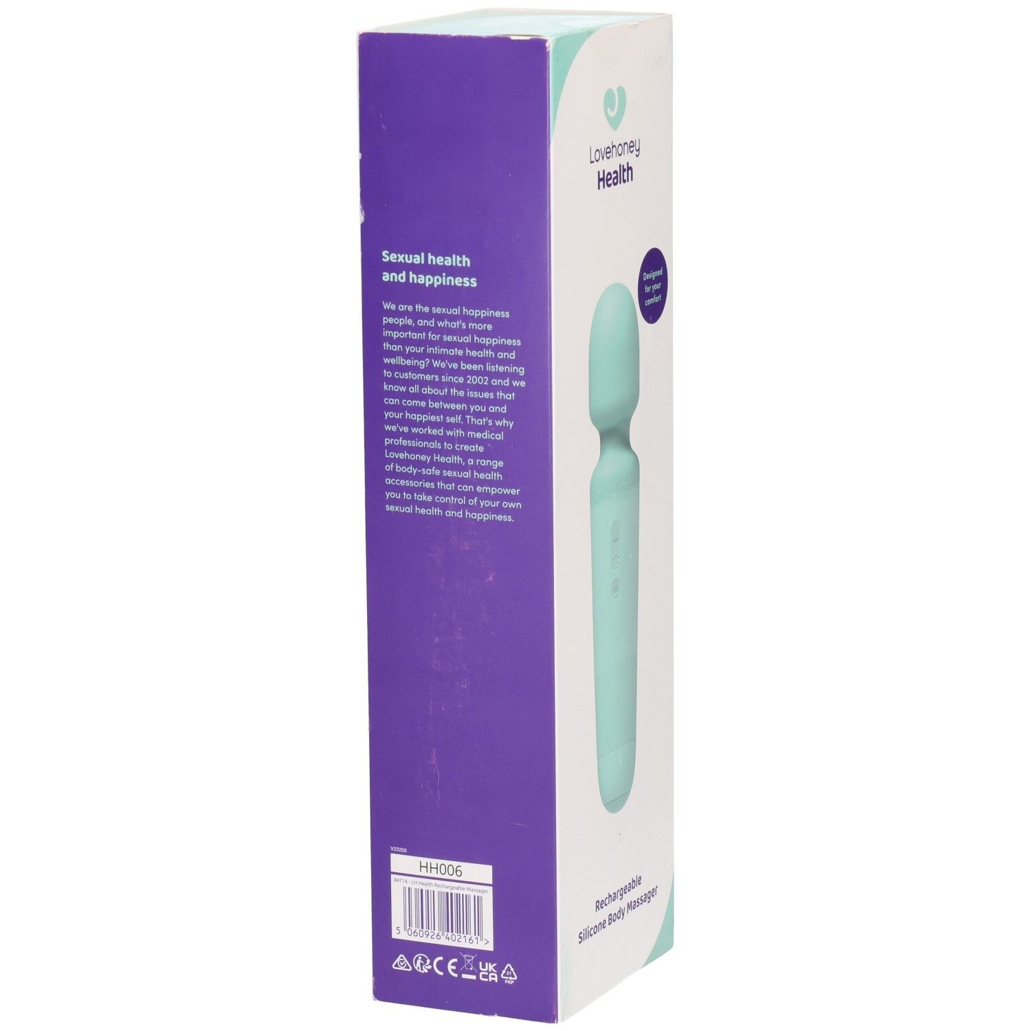 Verpackung des Massagegeräts. Aufschrift: Lovehoney Health. Text: Rechargeable Silicone Body Massager. Auf der Seite Text über Gesundheit und Glück.