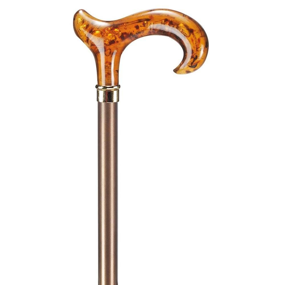 Gehstock mit Derbygriff aus bernsteinfarbenem Acryl und einem bronzefarbenen Schaft.
