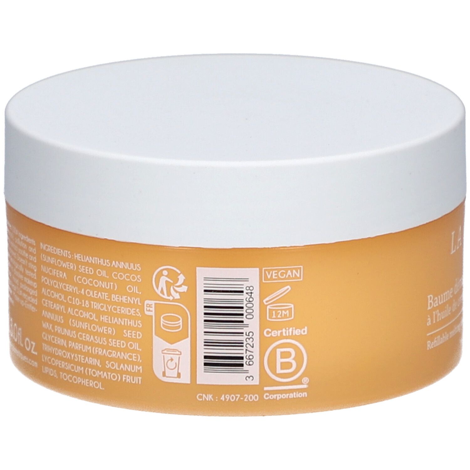 Runder Tiegel mit weißem Deckel. Auf der Rückseite: Inhaltsstoffe, Vegan-Logo, Zertifizierungszeichen, Barcode. Text in französischer Sprache.