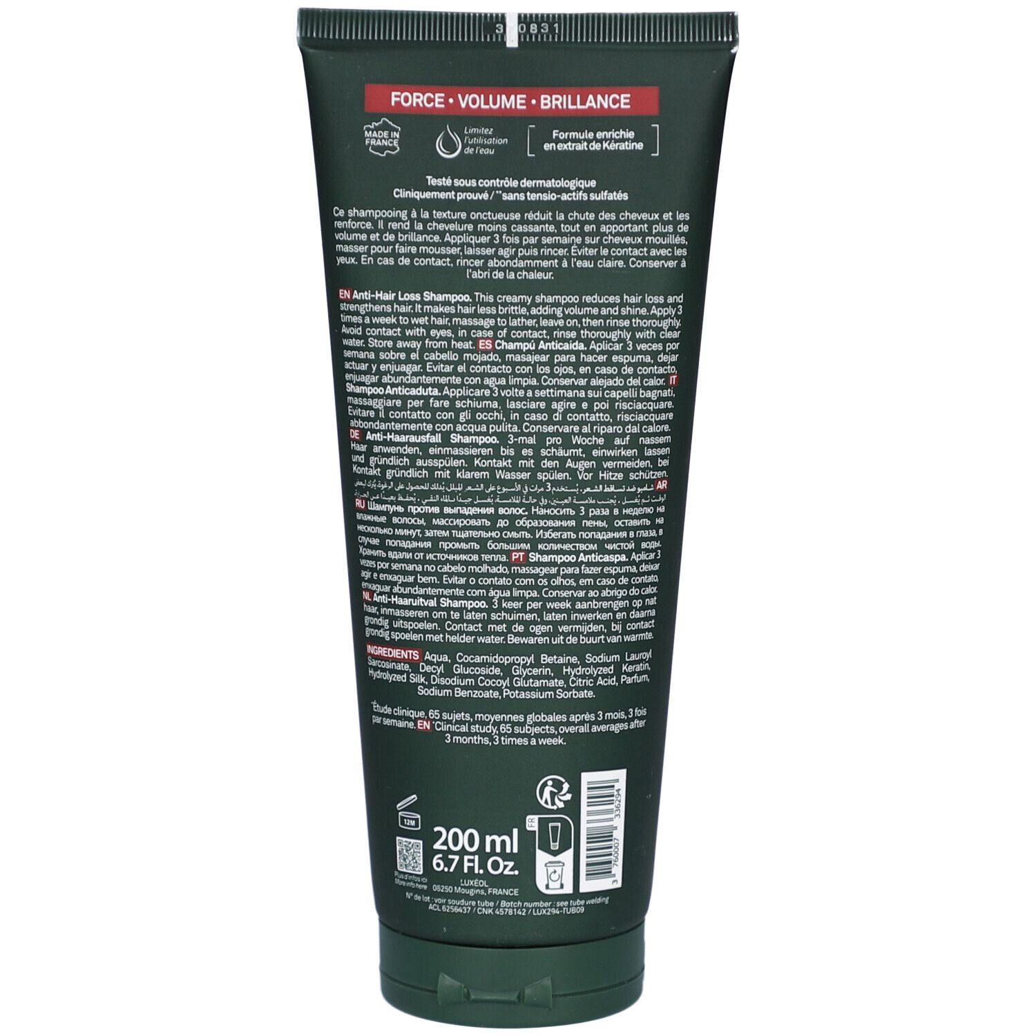 Dos du tube de shampooing. Texte multilingue. 200 ml. 6.7 Fl.oz. Tube vert avec bouchon noir.