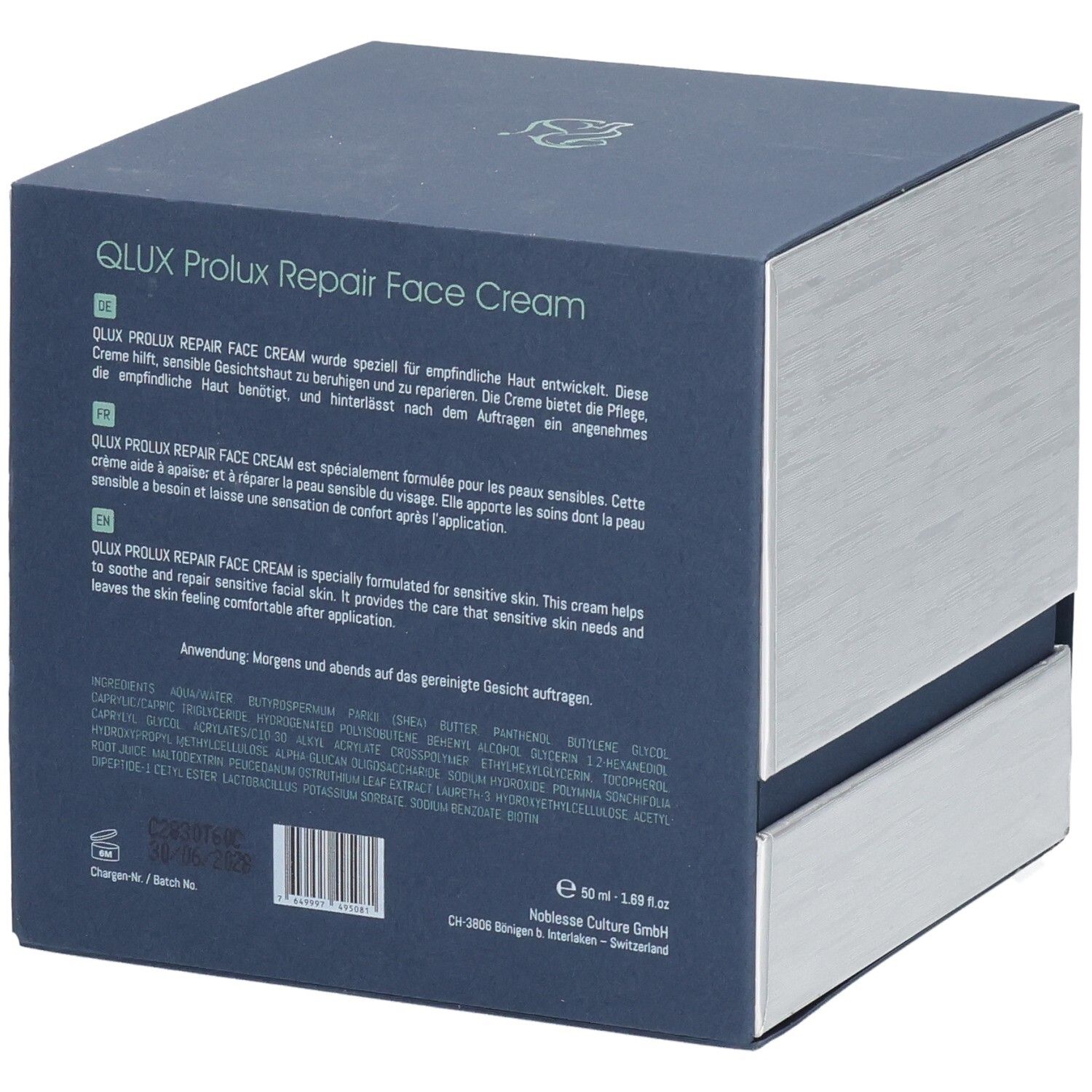 Rückseite der Verpackung. Text in Deutsch, Französisch und Englisch. Inhaltsstoffe. Schweizer Kreuz. QLUX Prolux Repair Face Cream.