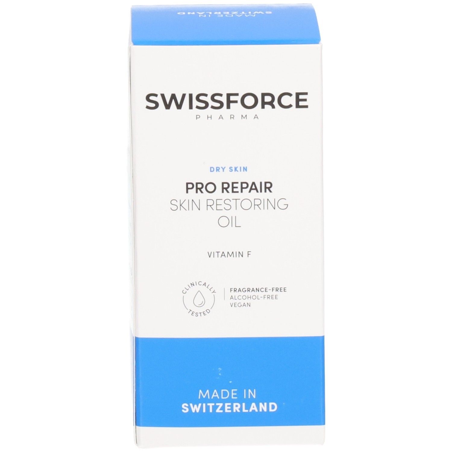 Boîte bleue et blanche. SWISSFORCE Pharma. Pro Repair Skin Restoring Oil. Vitamine F. Sans parfum, alcool, végétalien. Fabriqué en Suisse.