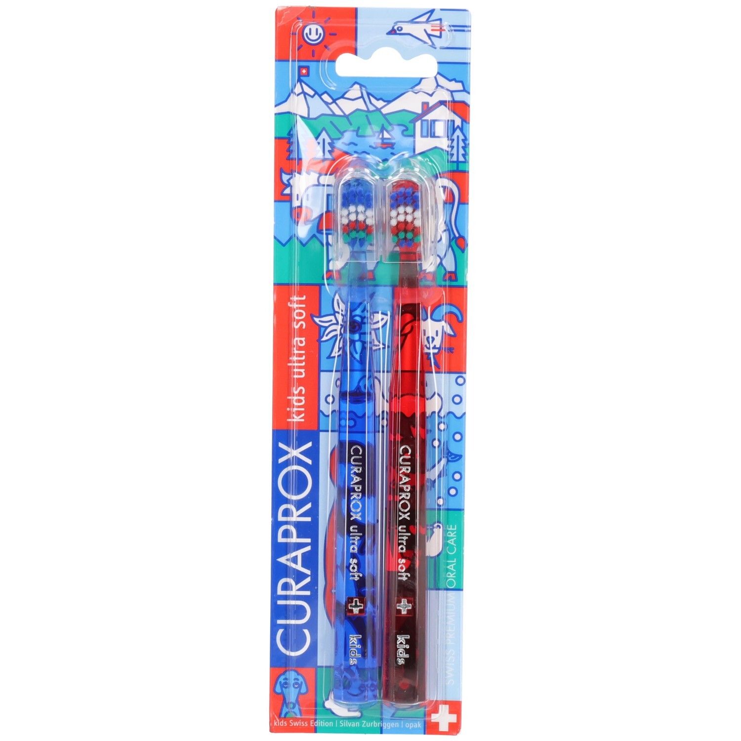 Zwei CURAPROX Kinderzahnbürsten in Blisterverpackung, eine blau, eine rot, mit "kids ultra soft" Aufschrift.