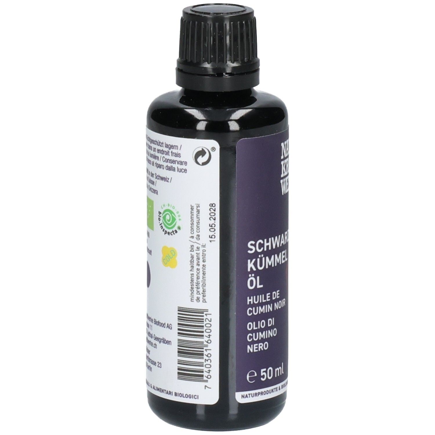 Arrière d'une bouteille de 50ml d'huile de cumin noir. Étiquette violette avec sceau bio et informations produit.