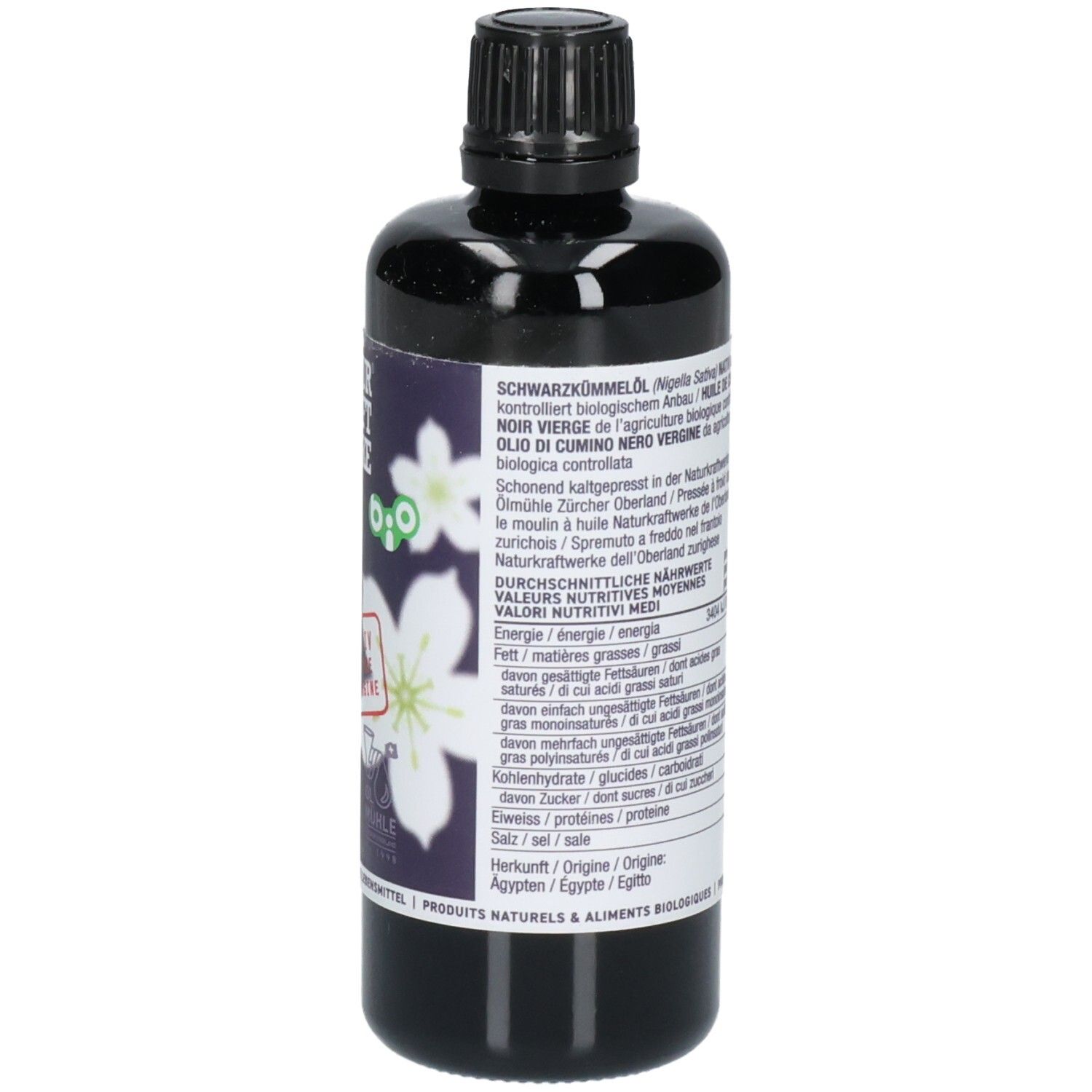 Côté d'une bouteille noire d'huile de cumin noir avec informations nutritionnelles et sceau bio.