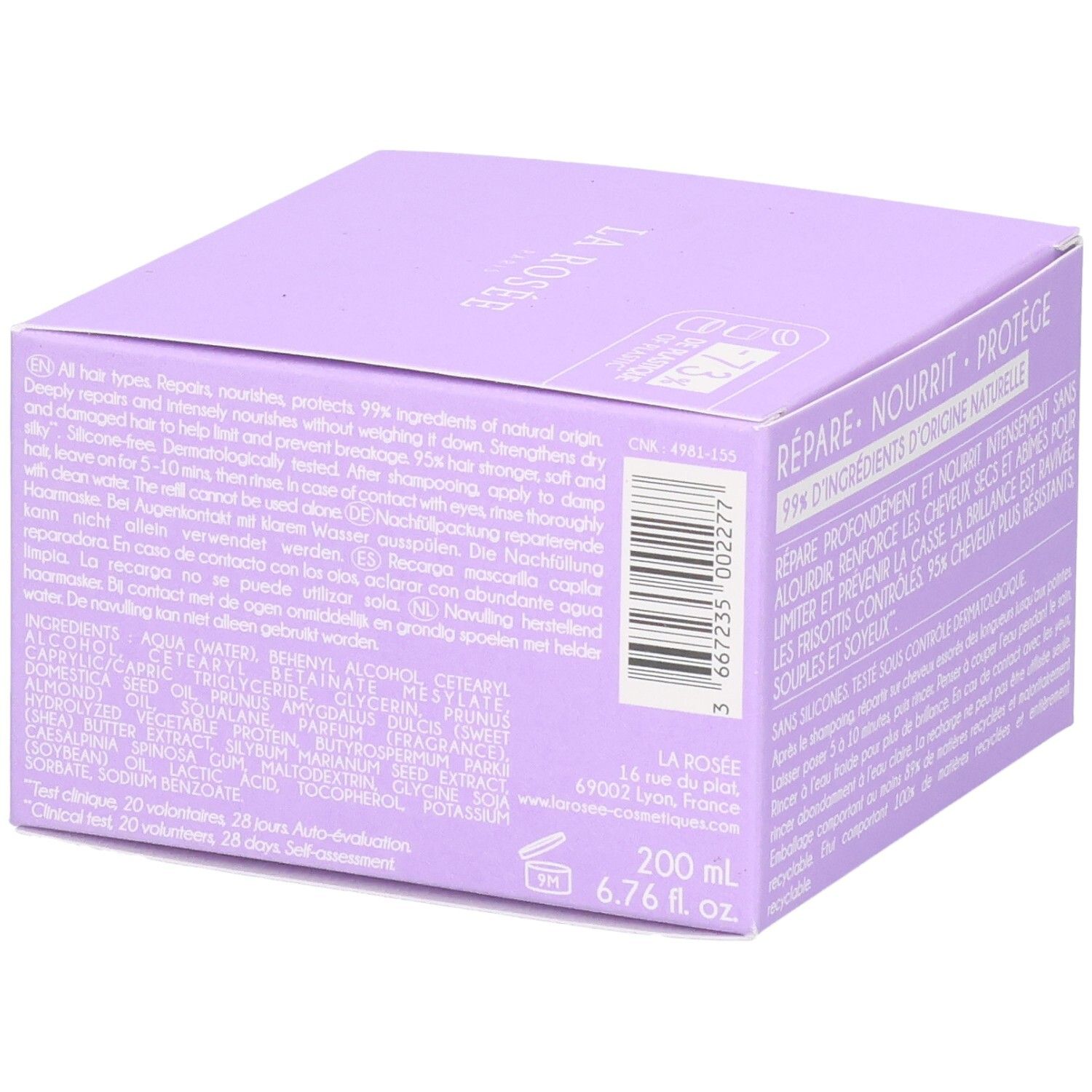 Lila Flasche mit weißem Verschluss, gefüllt mit klarem, lila gefärbtem Shampoo. Etikett mit Produktinformationen.