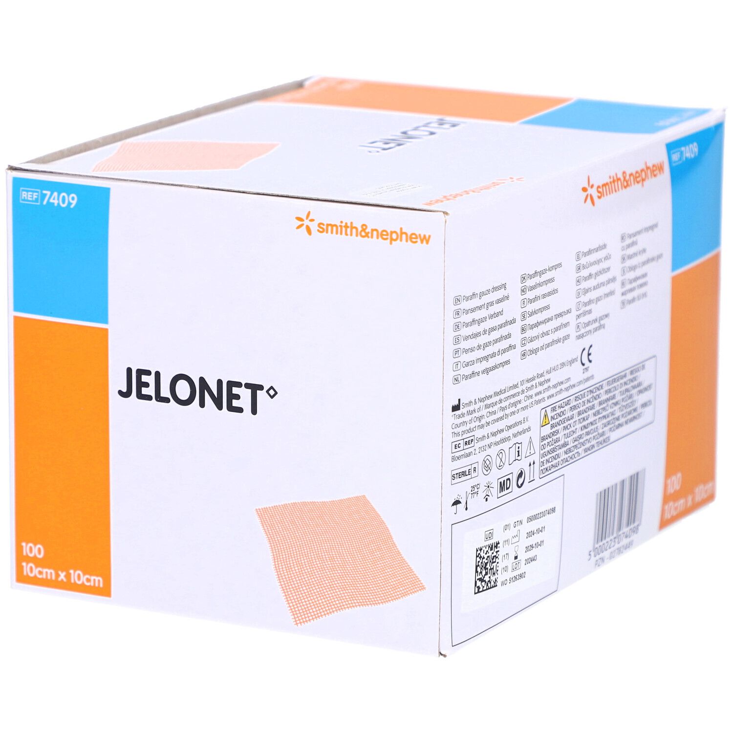 Boîte de compresses de gaze JELONET. Nom, logo et texte du produit. 100 pièces, 10cm x 10cm. Informations multilingues.