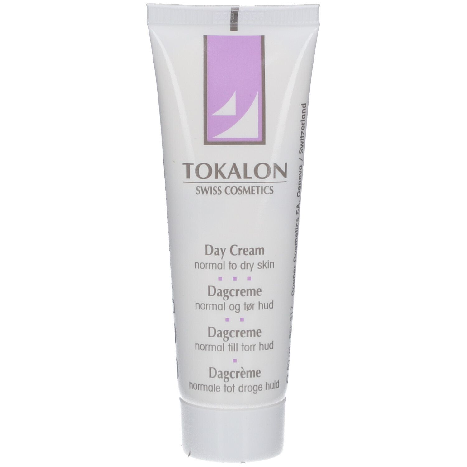 Tube blanc avec accents violets. Texte: TOKALON, Day Cream, pour peaux normales à sèches. Produit cosmétique.