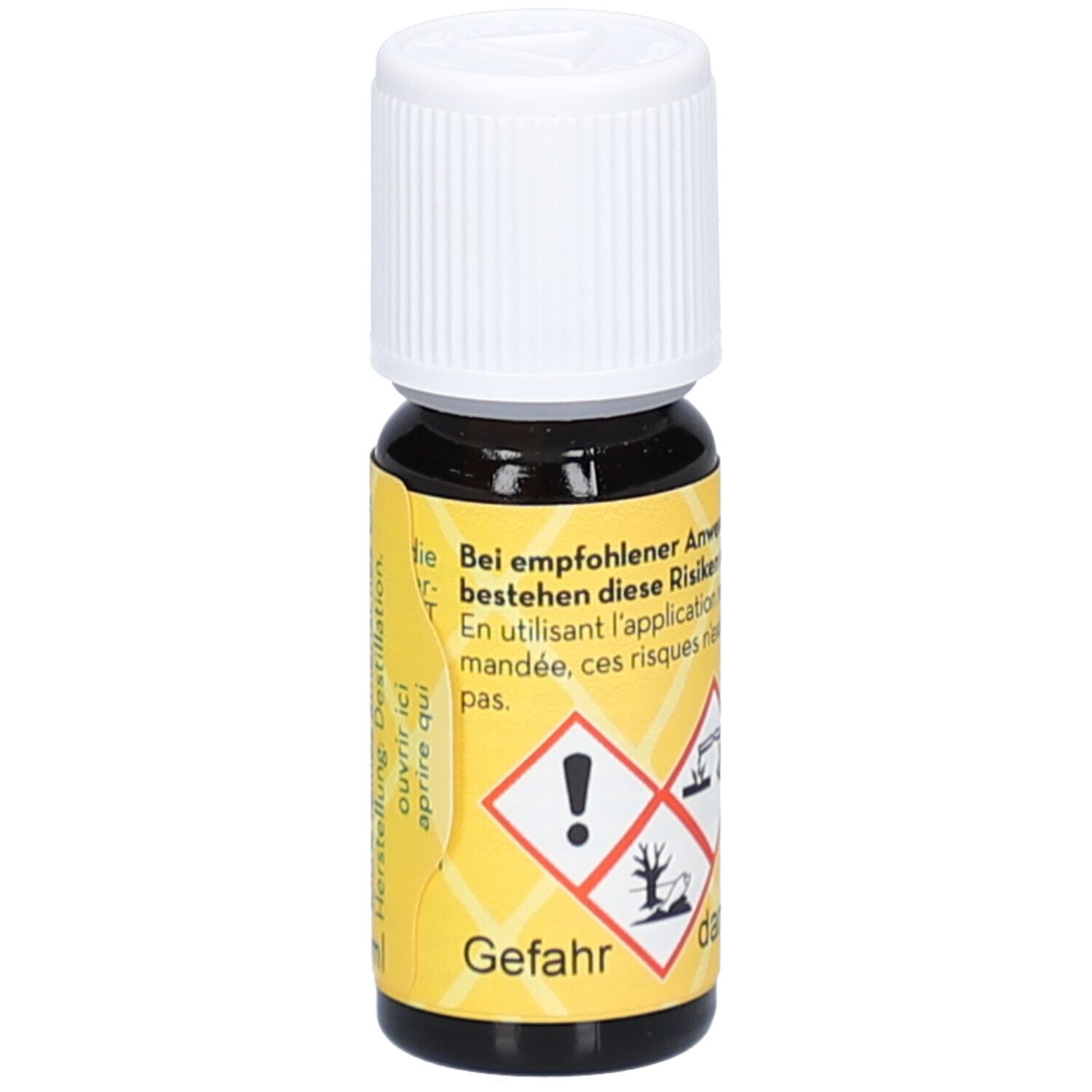 Flacon en verre brun avec bouchon blanc. Étiquette jaune avec symboles de danger et texte: danger, Lemongrass Cochin.