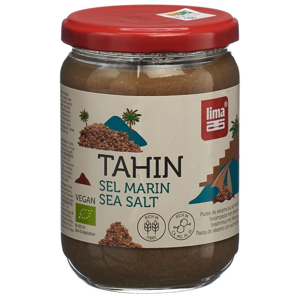 Pot de tahin au sel marin. Couvercle rouge, étiquette blanche avec nom du produit, logo et label bio. Vegan.