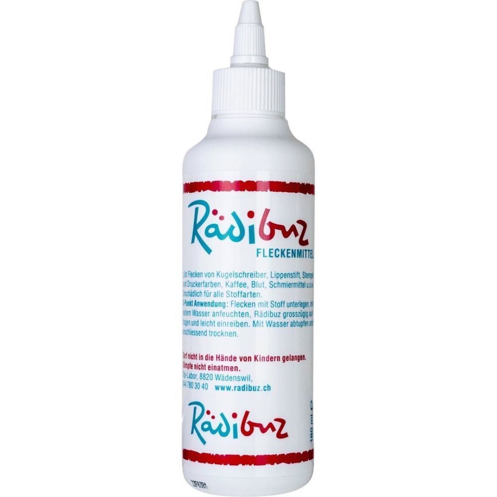 Weiße Flasche mit roter und blauer Beschriftung. Produktname: Rädibuz FLECKENMITTEL. Spitze zum Auftragen.