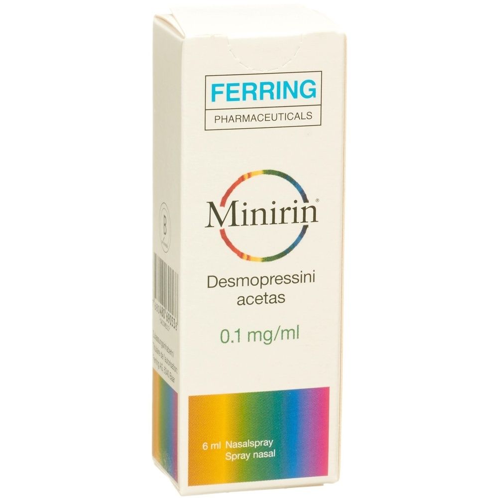 Weiße Verpackung mit "FERRING PHARMACEUTICALS" und "Minirin"-Logo. Enthält "Desmopressini acetas" und "0.1 mg/ml". Unten steht "6 ml Nasalspray".