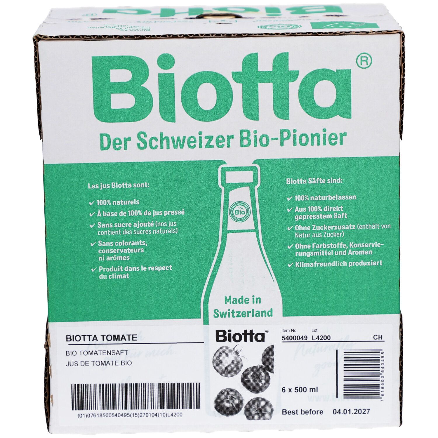 Carton BIOTTA Tomate Bio. Six bouteilles, 500 ml. Emballage vert et blanc. Texte: Le pionnier suisse du bio. Fabriqué en Suisse.