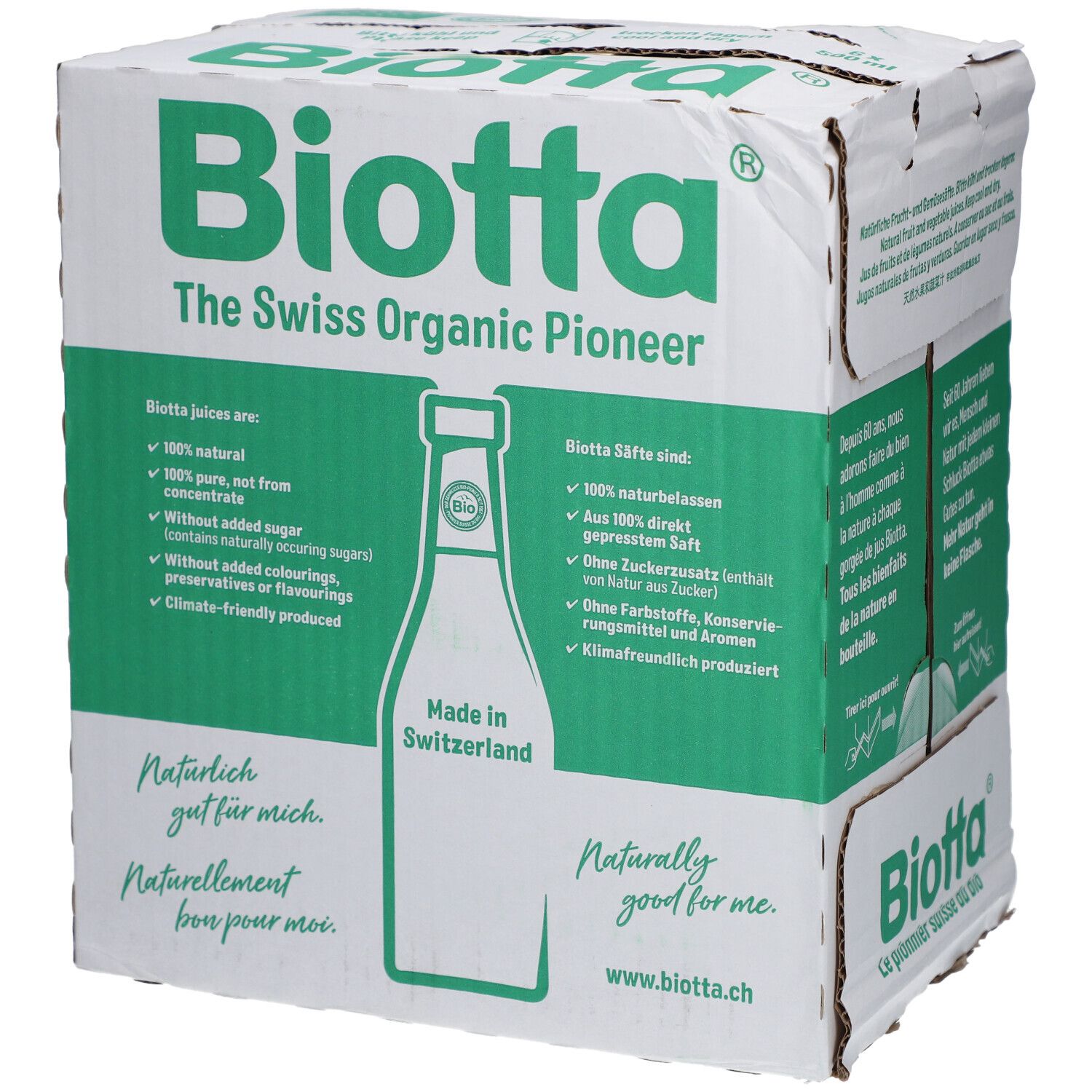 Karton mit BIOTTA-Logo und Text: "The Swiss Organic Pioneer". Enthält Informationen über Bio-Säfte. Aufdruck: "Made in Switzerland".