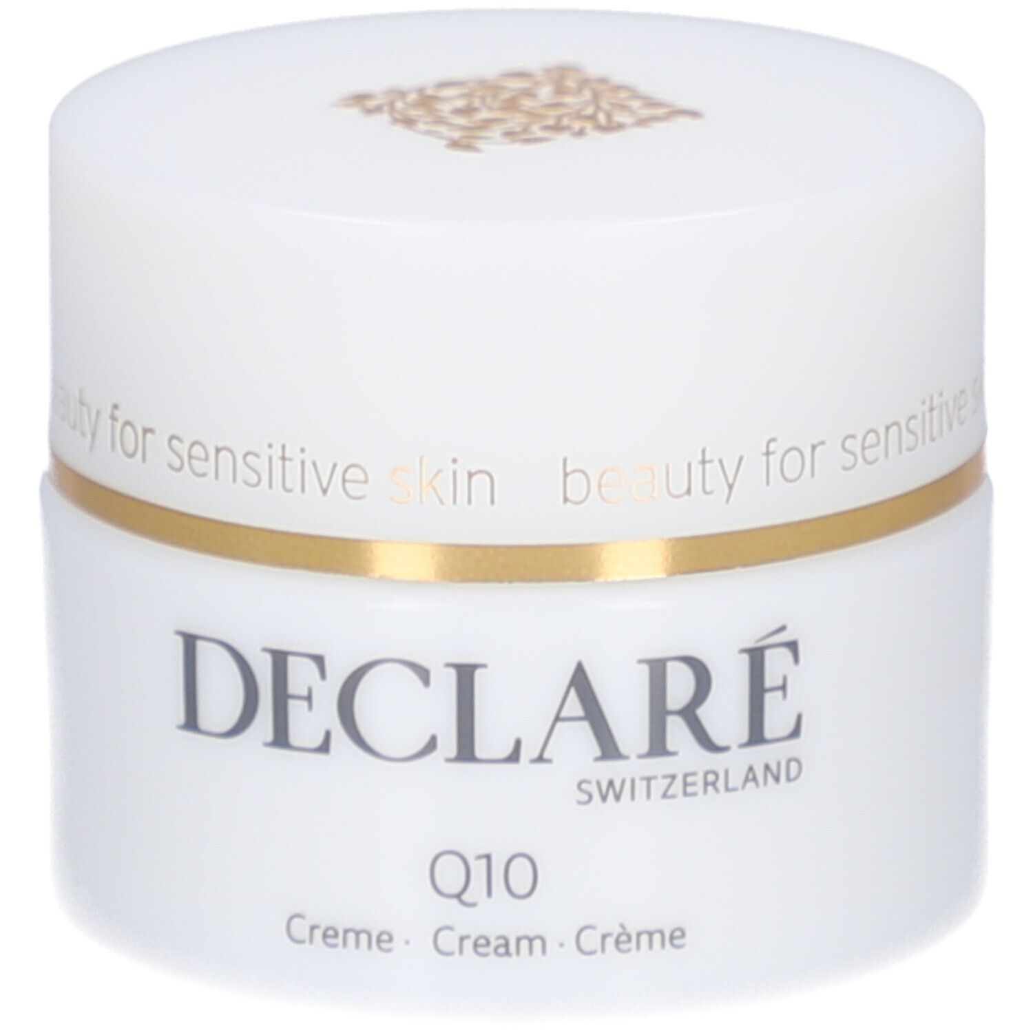 Pot blanc, bord doré. DECLARÉ, Q10 Crème. Inscription: beauty for sensitive skin.