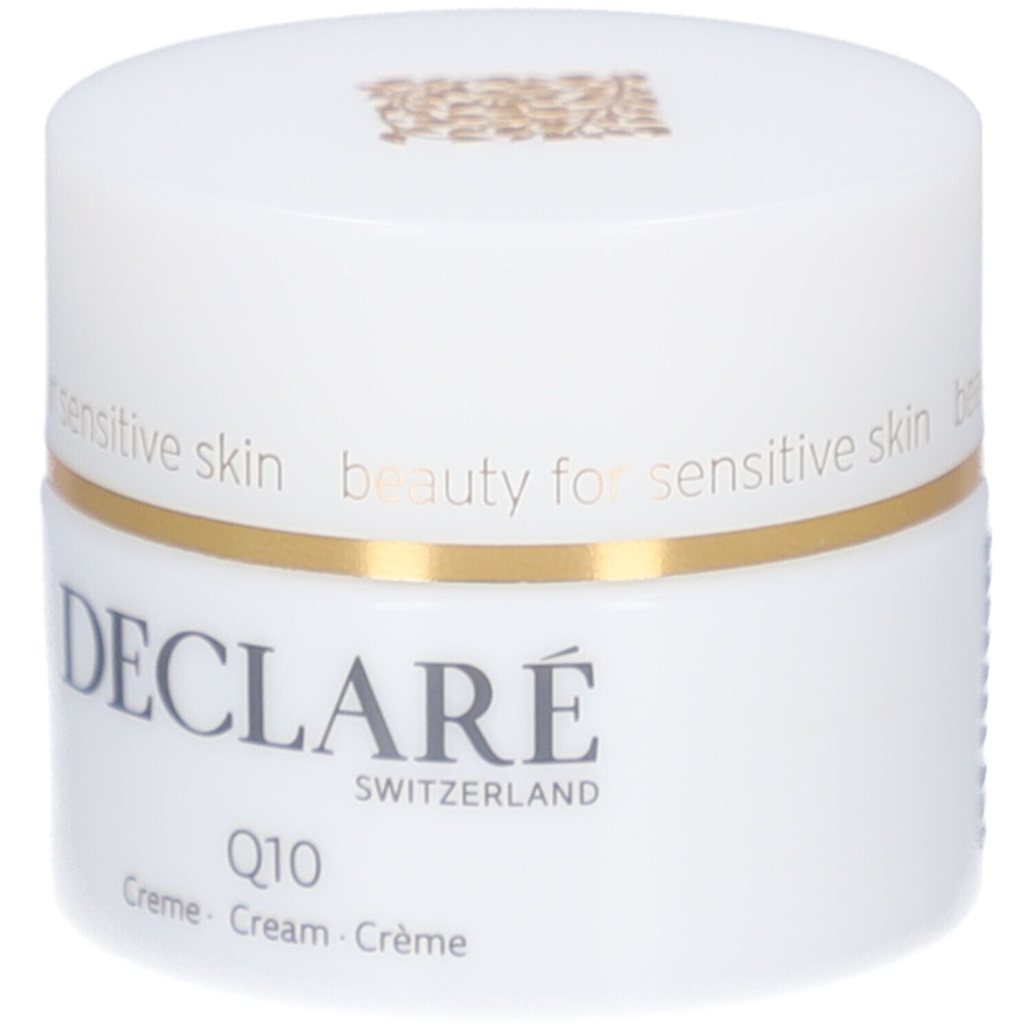 Pot blanc, bord doré. DECLARÉ, Q10 Crème. Inscription: beauty for sensitive skin.