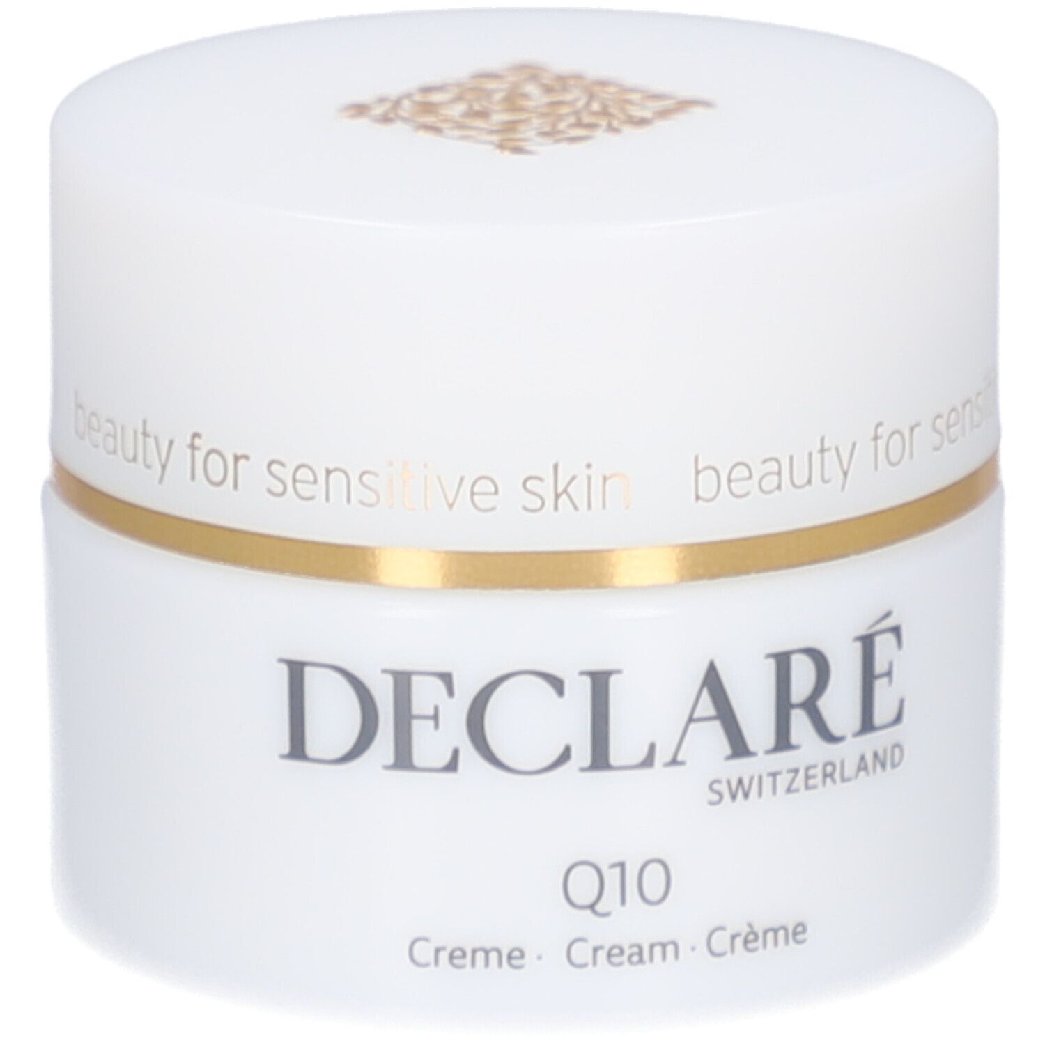 Pot blanc, bord doré. DECLARÉ, Q10 Crème. Inscription: beauty for sensitive skin.