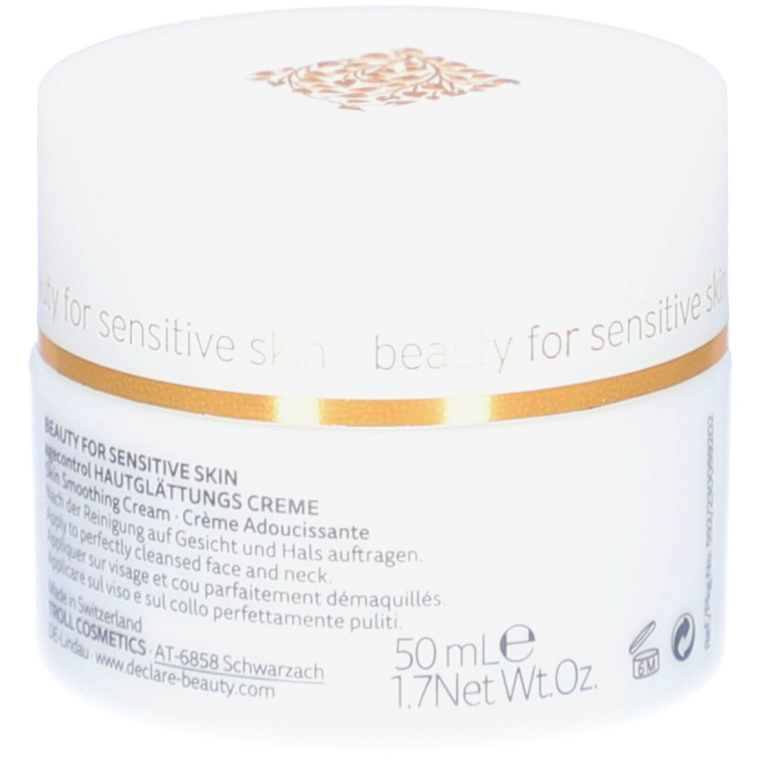 Pot blanc avec couvercle. Bande dorée. Logo DECLARÉ et nom du produit. Inscription: Crème Adoucissante. 50 ml.