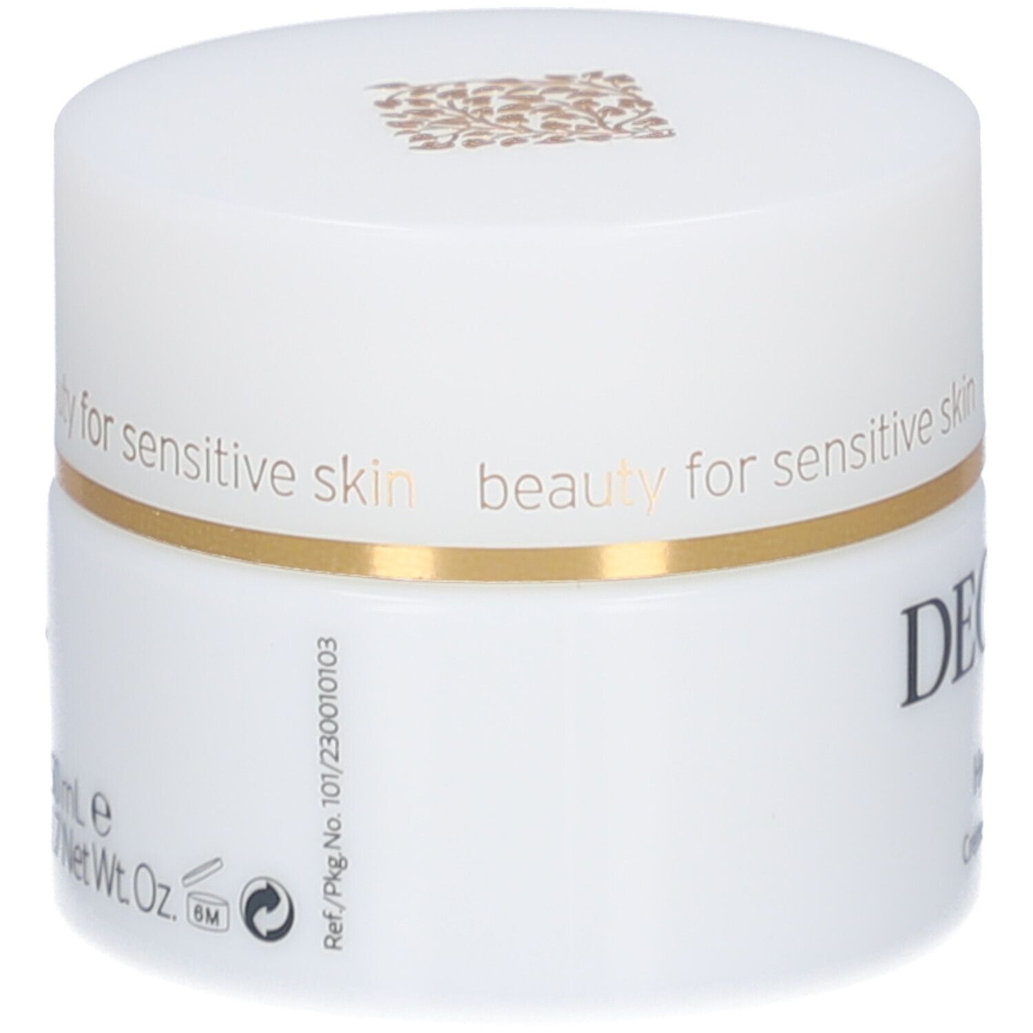 Pot de crème blanc avec couvercle. Anneau doré. Inscription : DECLARÉ. Dos avec texte et symboles.