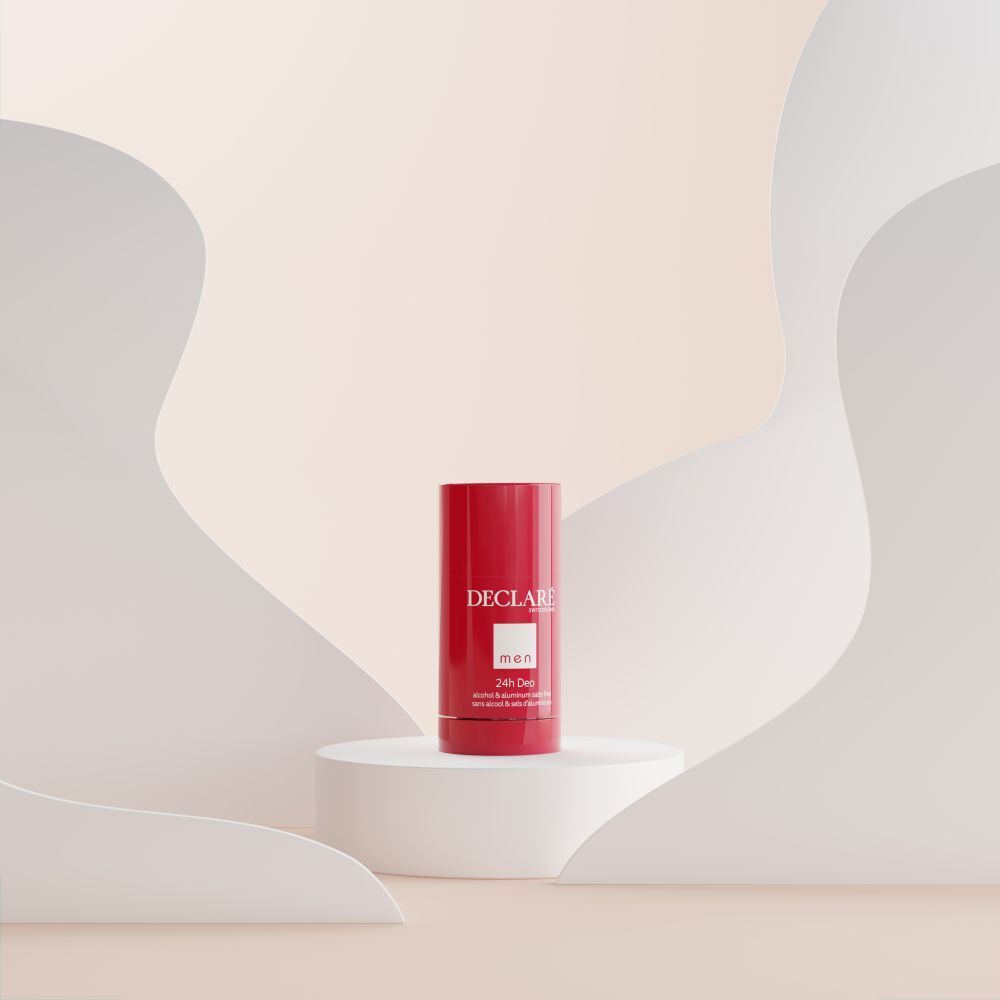 Roter Deostift auf weißem Podest. Hintergrund mit weißen, geschwungenen Formen.