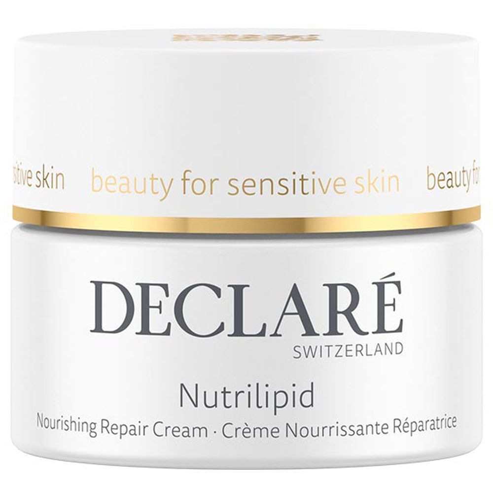 Pot blanc avec couvercle doré. Inscription : DECLARÉ, Nutrilipid, Nourishing Repair Cream. Pour peaux sensibles.