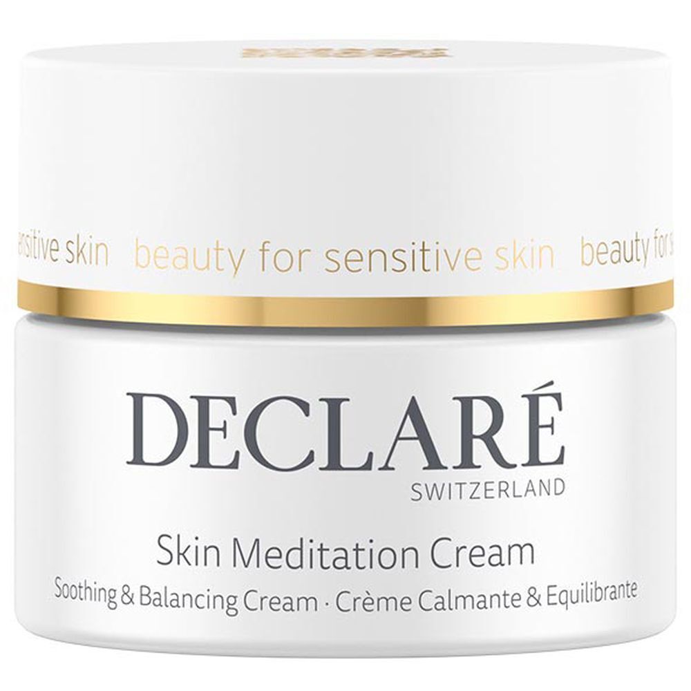 Pot de crème blanc avec bord doré. Inscription : DECLARÉ SWITZERLAND, Skin Meditation Cream. Crème apaisante et équilibrante.