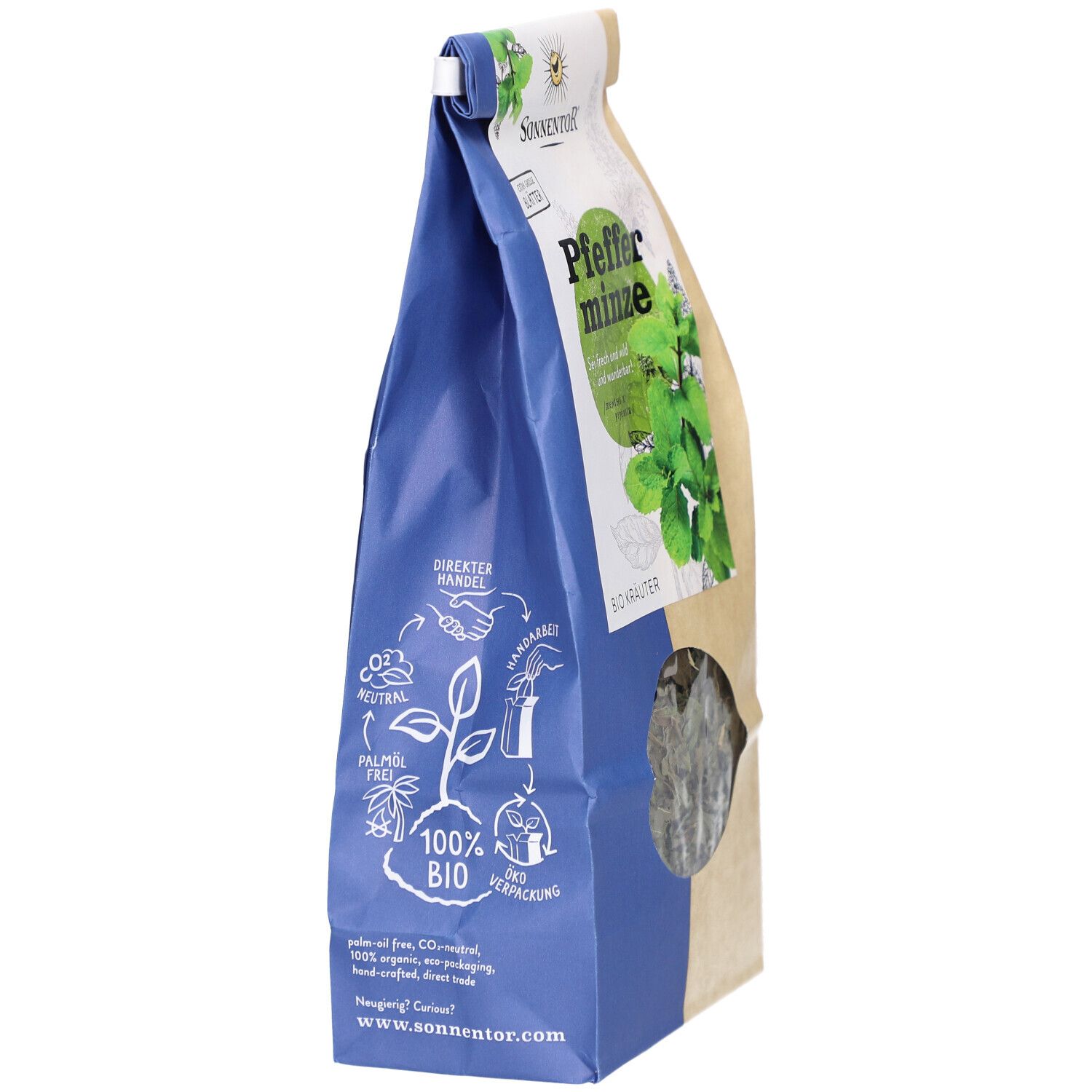 Sachet de thé BIO avec logo SONNENTOR. Inscriptions : 100% BIO, commerce direct, durable, sans huile de palme. Fenêtre avec herbes.