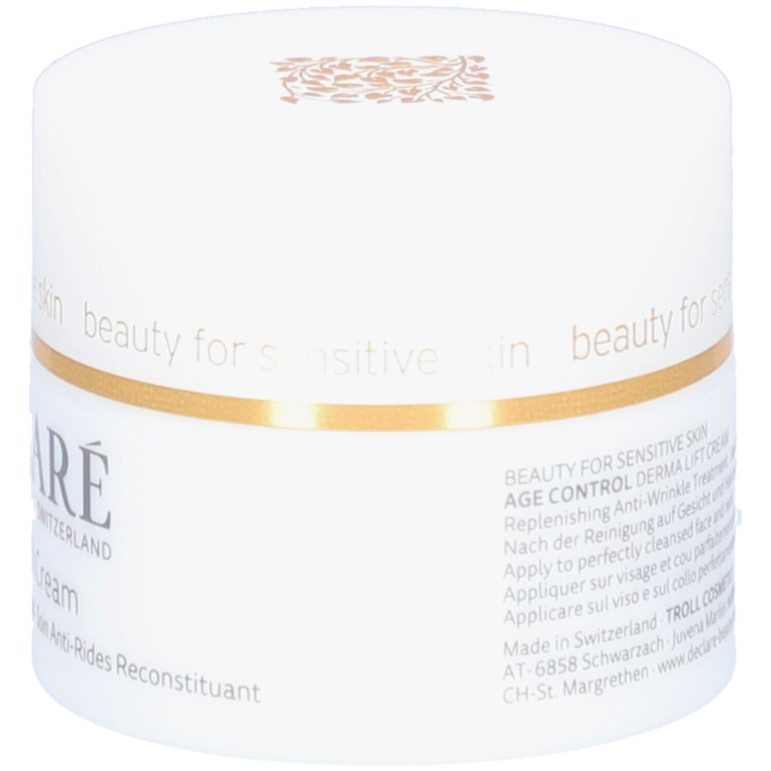 Pot blanc avec anneau doré. Inscription : DECLARÉ SWITZERLAND, Derma Lift Cream. Texte : Replenishing Anti-Wrinkle Treatment.