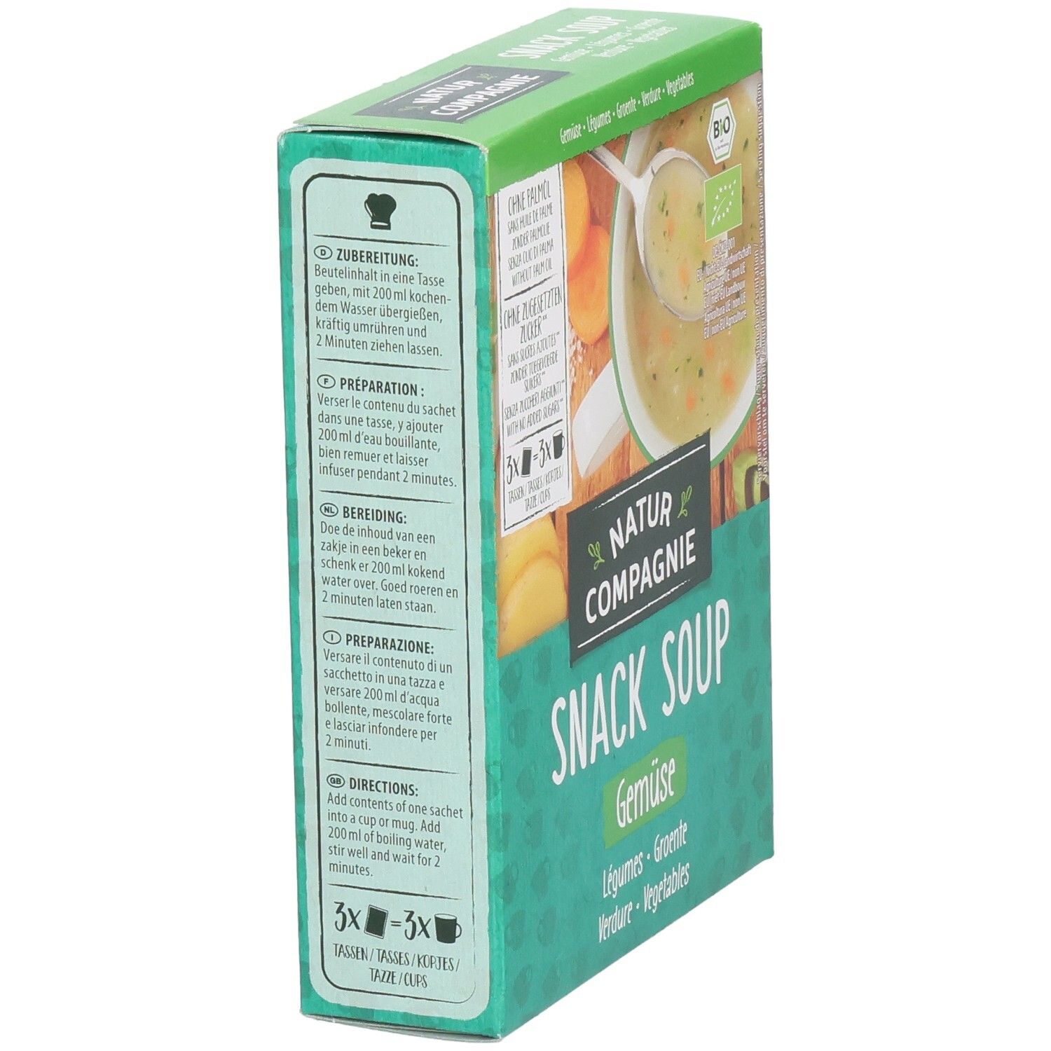 Grüne Schachtel mit "Natur Compagnie Snack Soup Gemüse". Text: Zubereitung, Zutaten. Bio-Siegel.