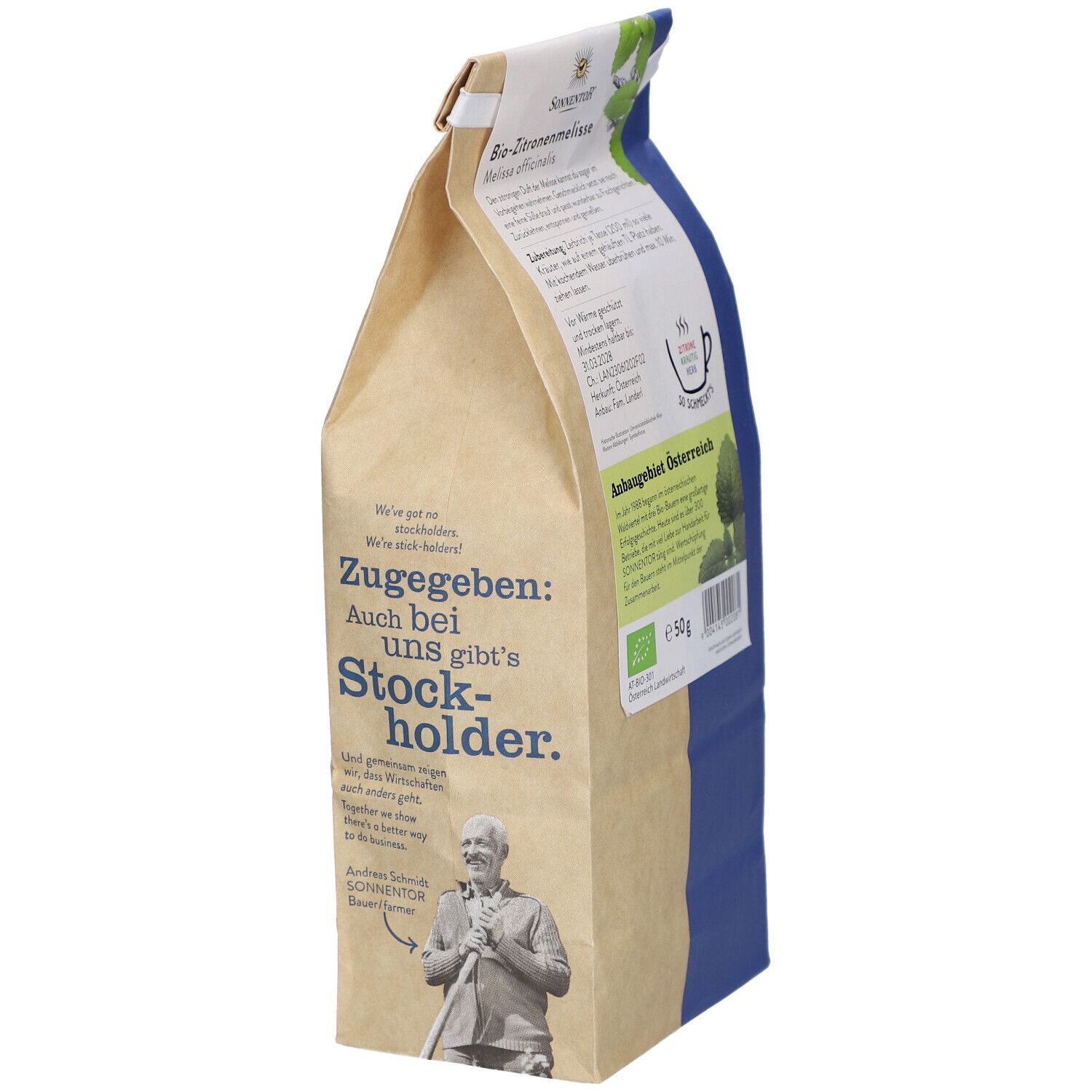 Emballage Sonnentor Mélisse citronnelle bio. Inscription : Zugabe: Auch bei uns gibt's Stockholder. Image d'un homme avec une faux.