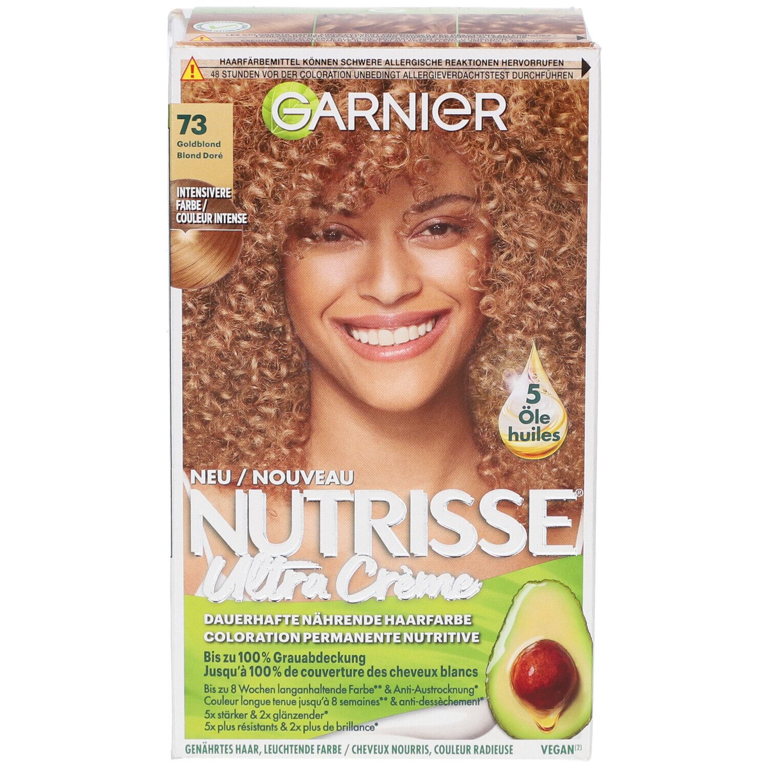 Boîte Garnier Nutrisse Crème Permanente 73 Blond doré. Femme aux cheveux bouclés. Illustration d'avocat.