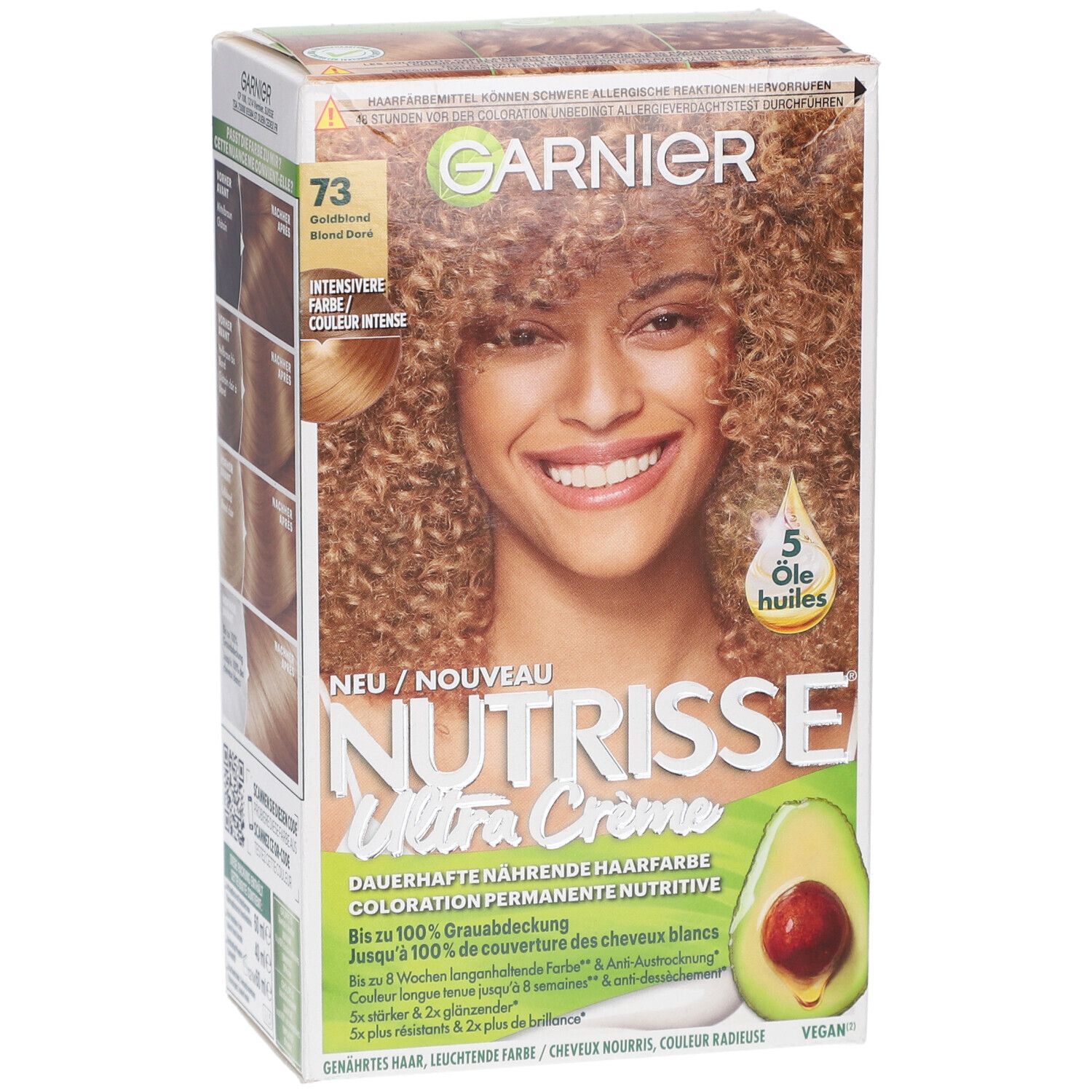 Boîte Garnier Nutrisse Crème Permanente 73 Blond doré. Femme aux cheveux bouclés. Illustration d'avocat.