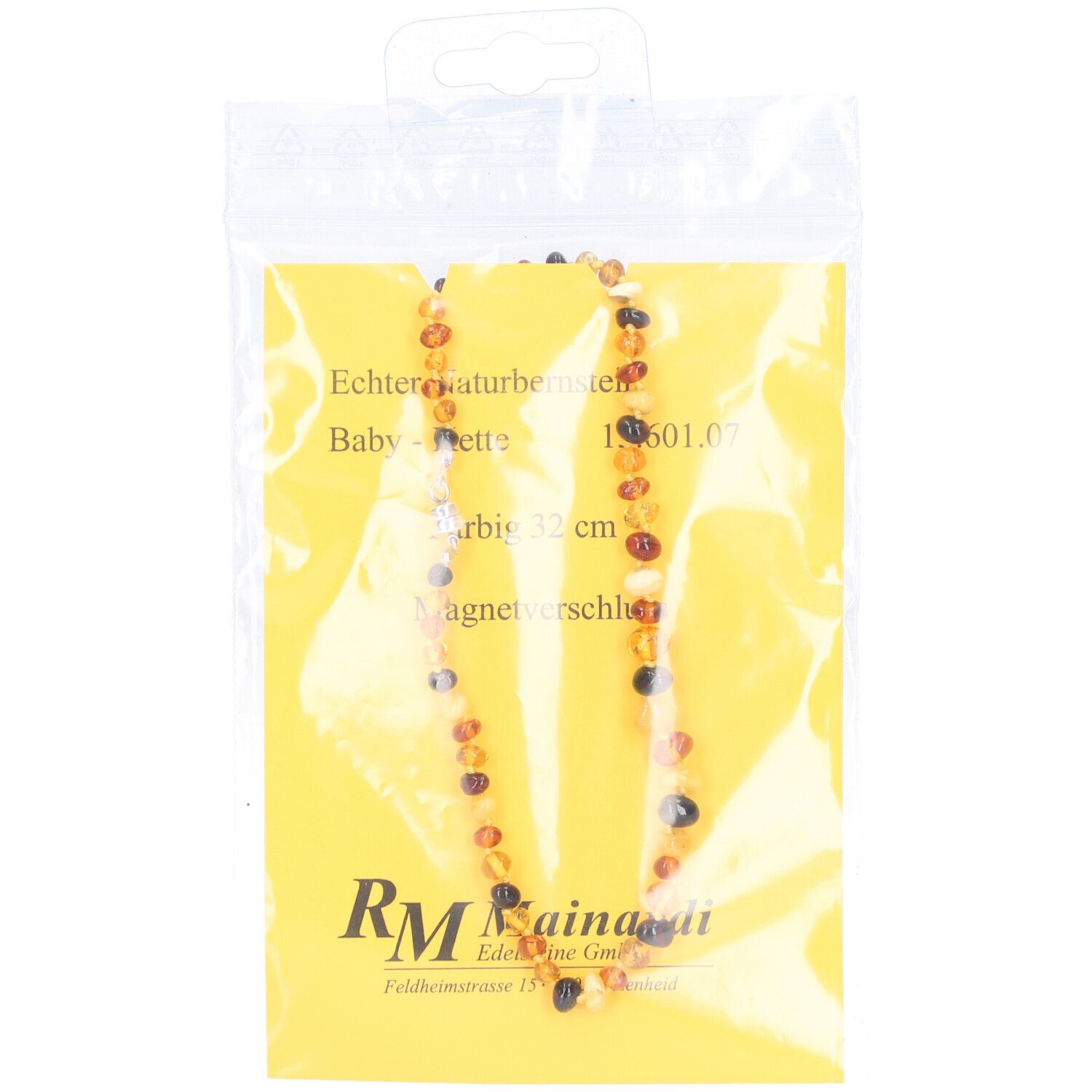 Collier en ambre dans un emballage plastique. Perles colorées, 32 cm, fermeture magnétique. Fond jaune avec texte.