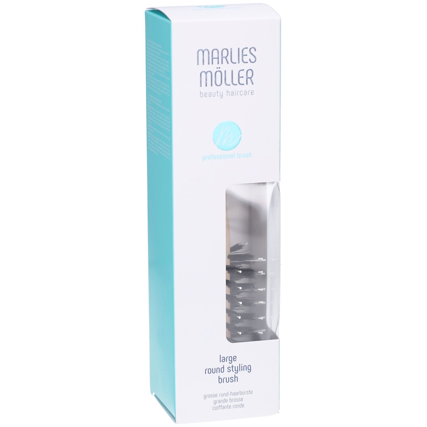 Verpackung mit Rundbürste. Marke Marlies Möller. Sichtfenster zeigt Bürste. Text: large round styling brush.