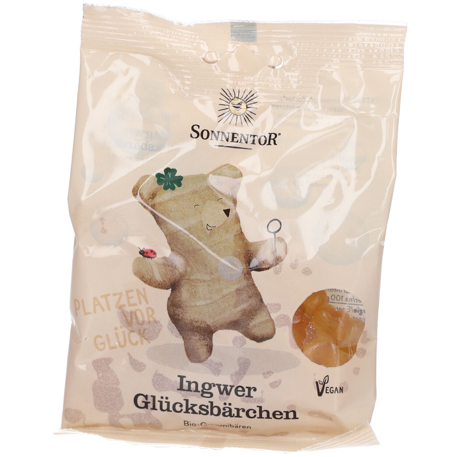 Klarsichtverpackung mit Ingwer Glücksbärchen. Aufdruck: SONNENTOR, Glücksbärchen-Illustration, vegan.