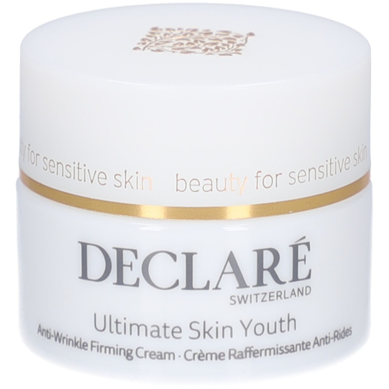 Pot blanc avec couvercle. Anneau doré. Inscription : DECLARE, Ultimate Skin Youth Anti-Wrinkle Firming Cream.