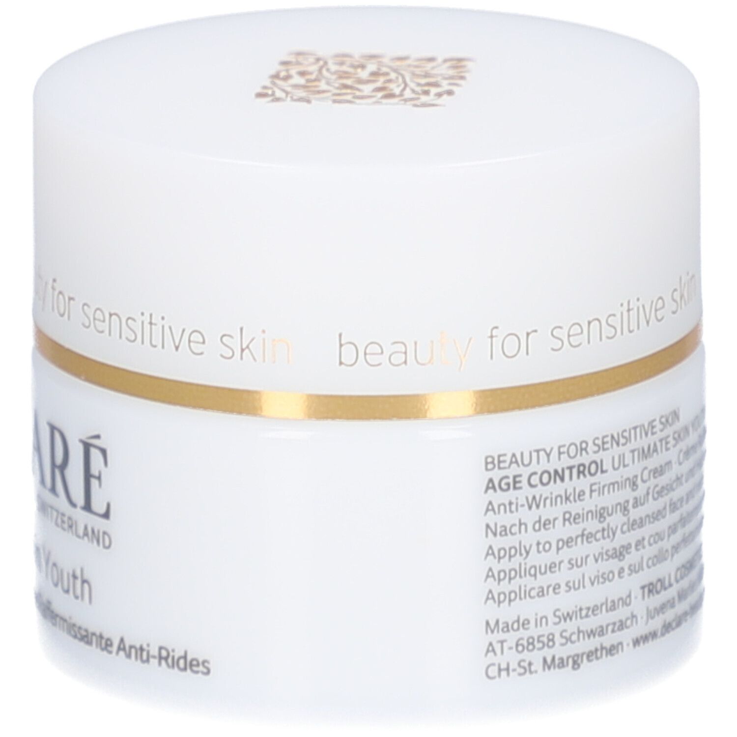 Pot blanc avec couvercle. Anneau doré. Inscription : DECLARE, Ultimate Skin Youth Anti-Wrinkle Firming Cream.