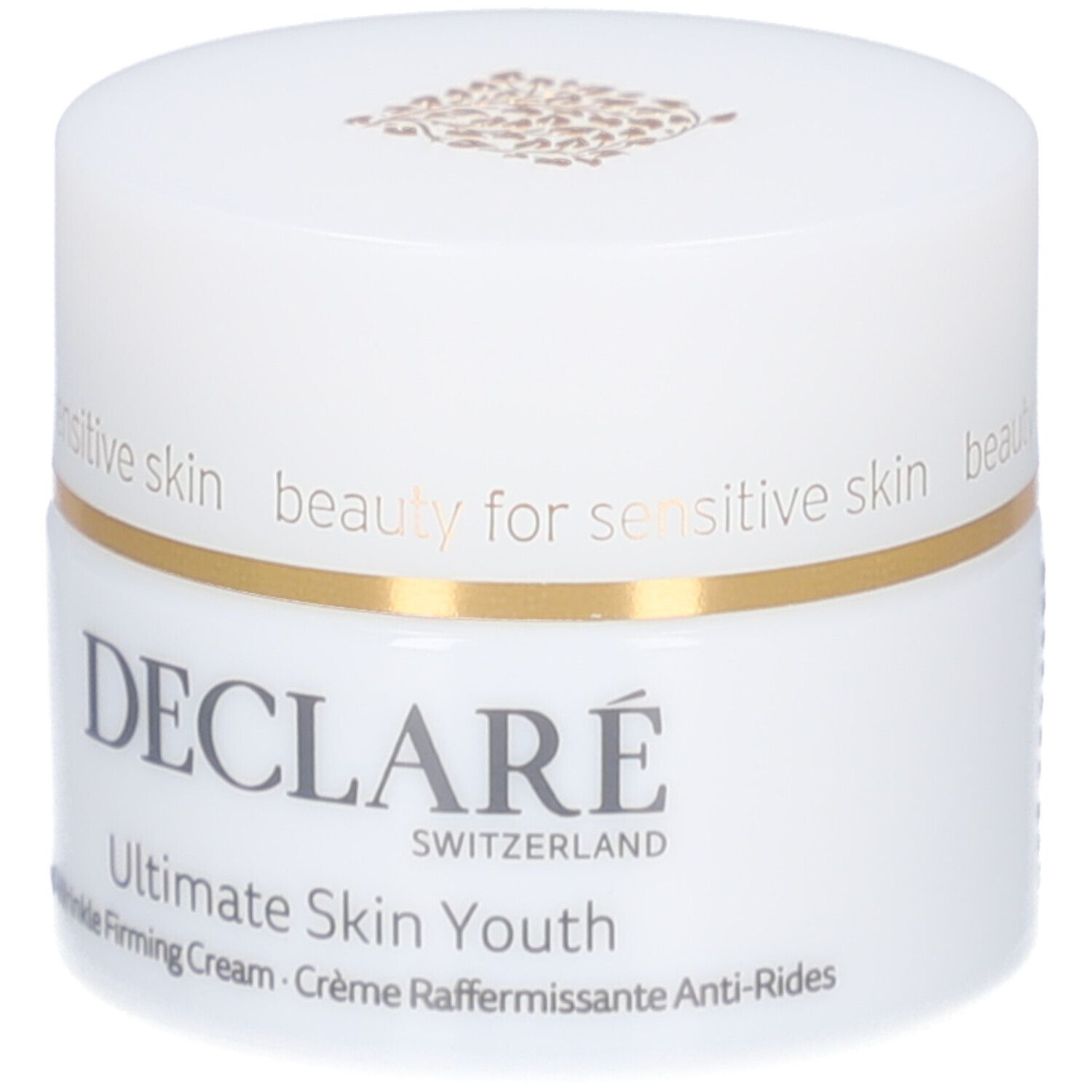 Pot blanc avec couvercle. Anneau doré. Inscription : DECLARE, Ultimate Skin Youth Anti-Wrinkle Firming Cream.