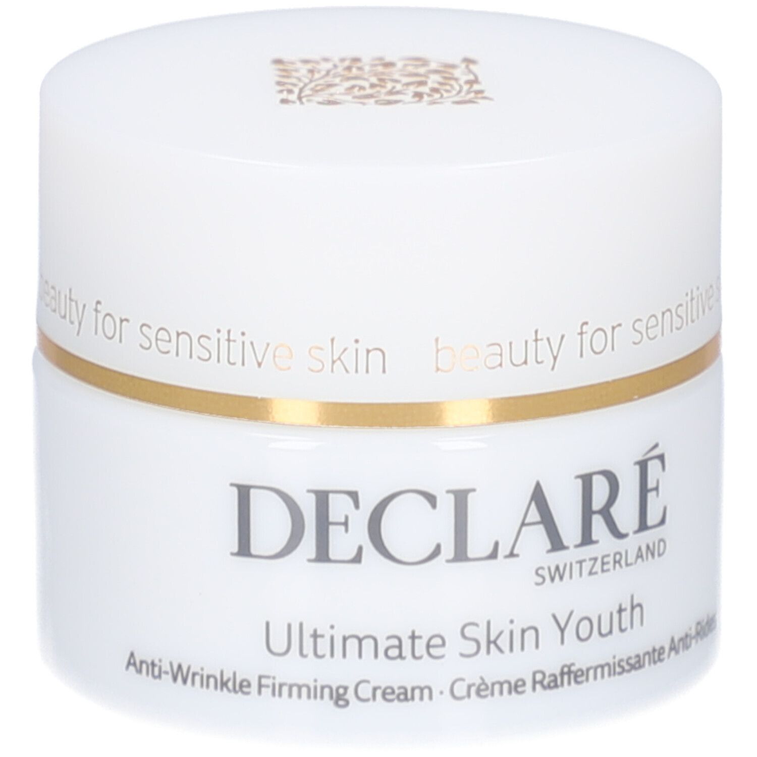 Pot blanc avec couvercle. Anneau doré. Inscription : DECLARE, Ultimate Skin Youth Anti-Wrinkle Firming Cream.
