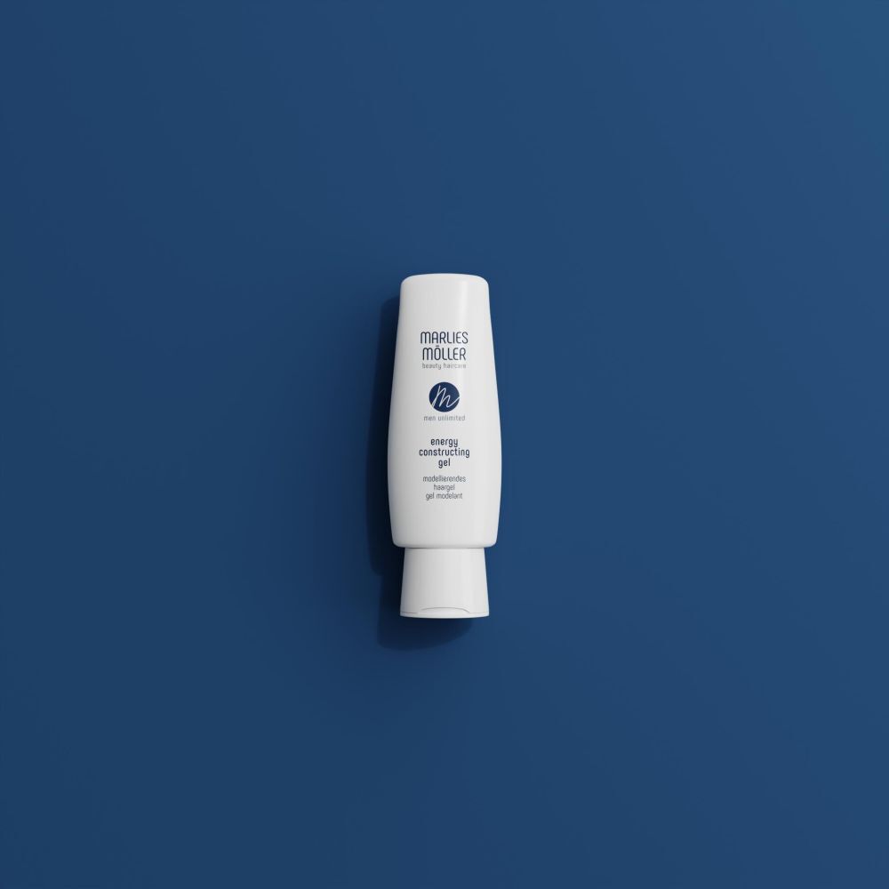 Flacon de gel capillaire blanc. Marque Marlies Möller. Texte: energy constructing gel. Sur fond bleu.