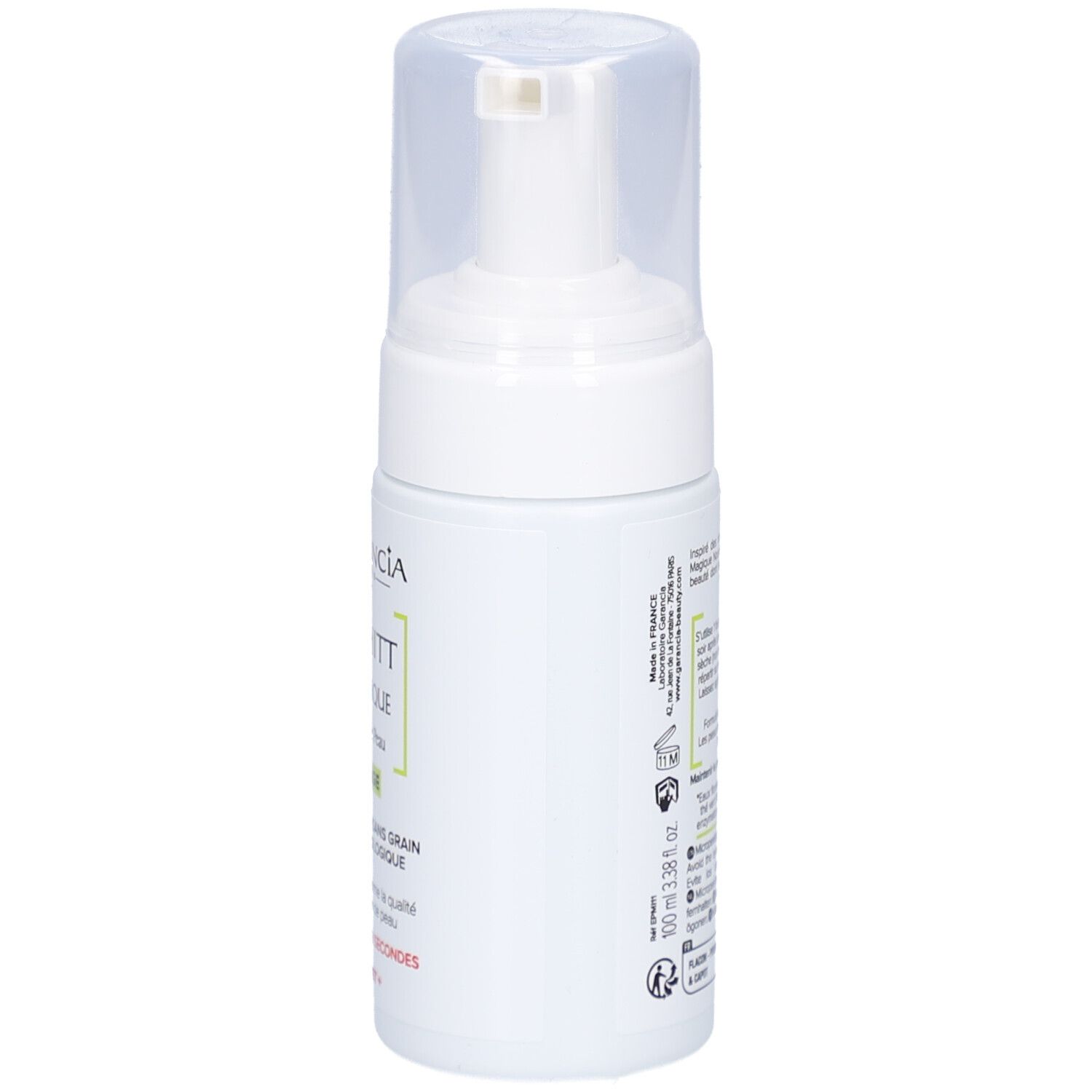 Flacon blanc avec pompe. Inscription: GARANCIA, Pschitt Magique, Nouvelle Peau, Visage. Texte en français.