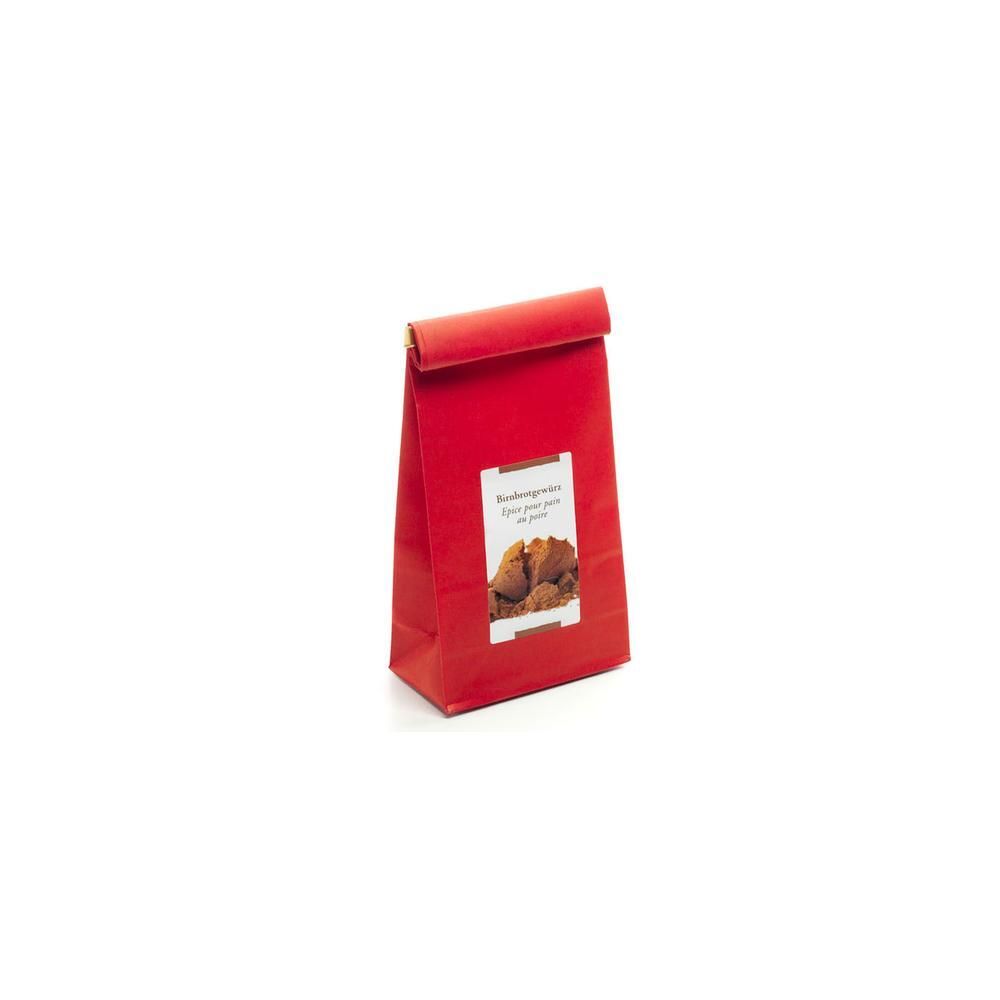 Rote Papiertüte mit Gewürzmischung für Birnbrot, Etikett mit Bild von Zimtstangen und Früchten.