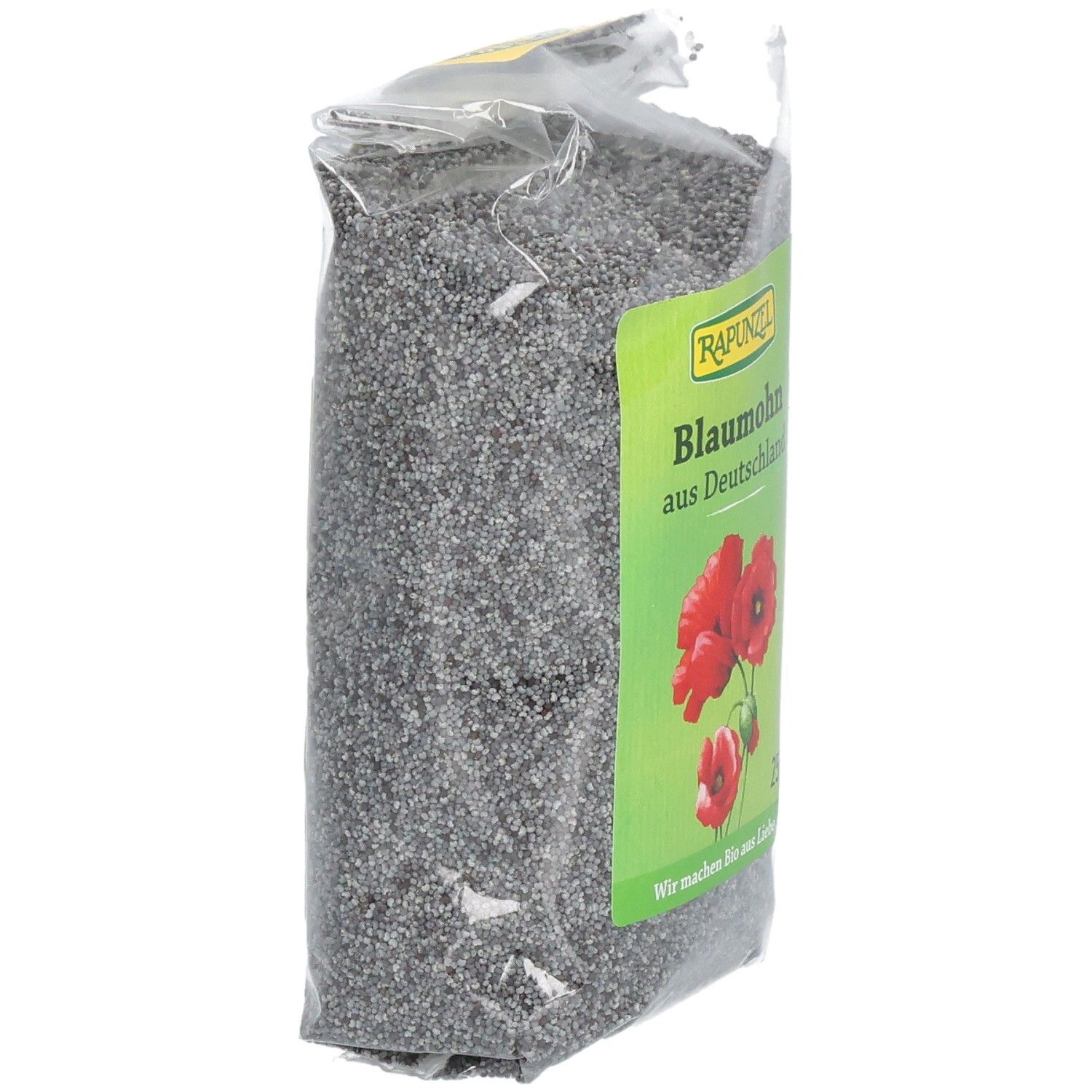 Emballage de graines de pavot bleu en biais. Étiquette verte avec "RAPUNZEL", "Blaumohn aus Deutschland", fleurs et texte.