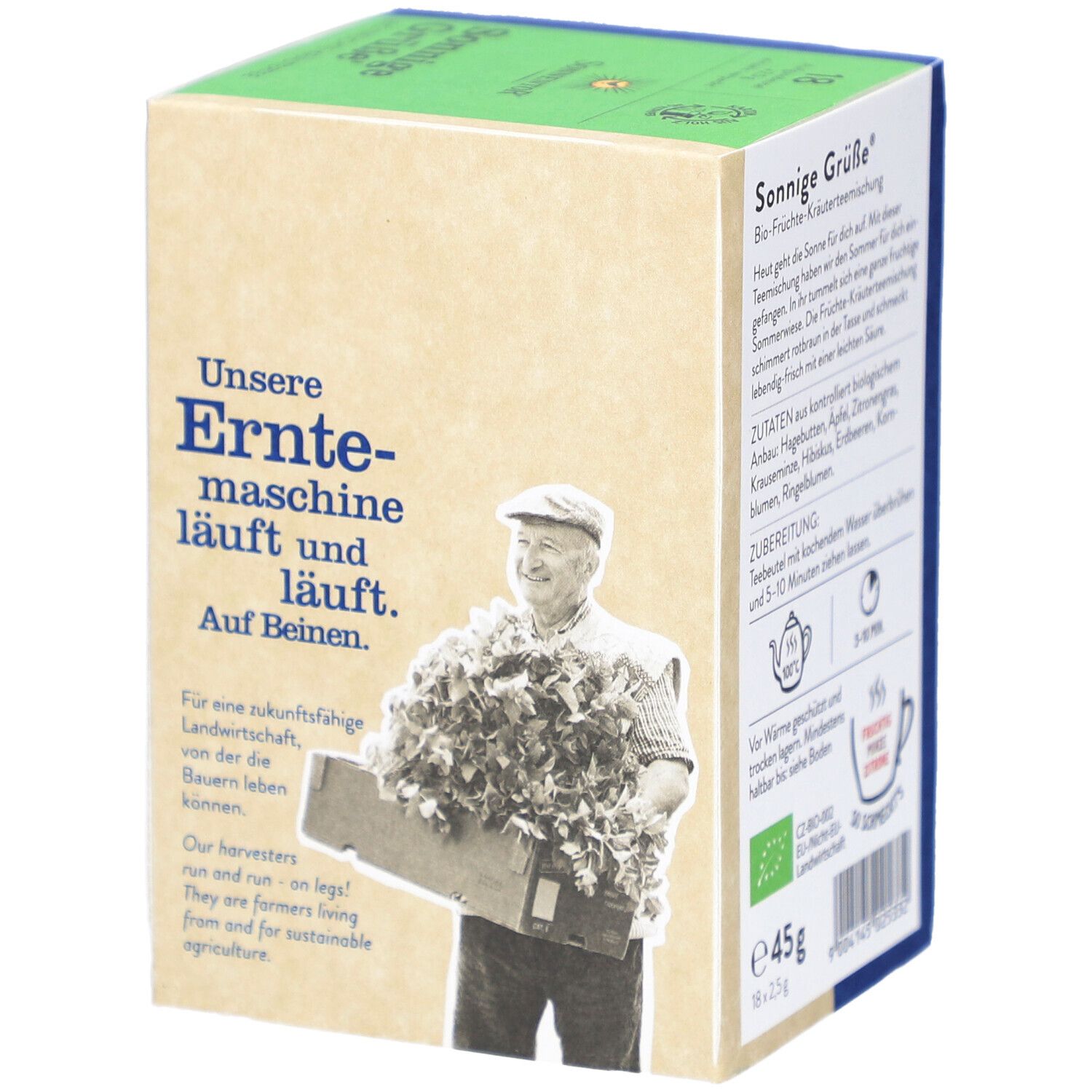 Boîte de thé SONNENTOR. Inscription : Unsere Erntemaschine läuft. Homme avec des feuilles. Texte : Pour une agriculture durable.