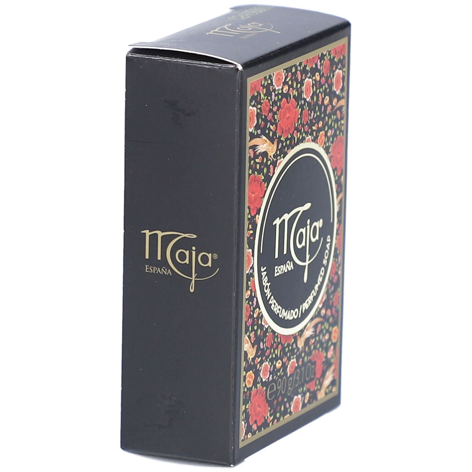 Schwarze Schachtel mit floralem Muster. Logo "Maja" auf der Seite. Text: "Jabón Perfumado / Perfumed Soap". Gewicht: 90 g / 3.1 Oz.